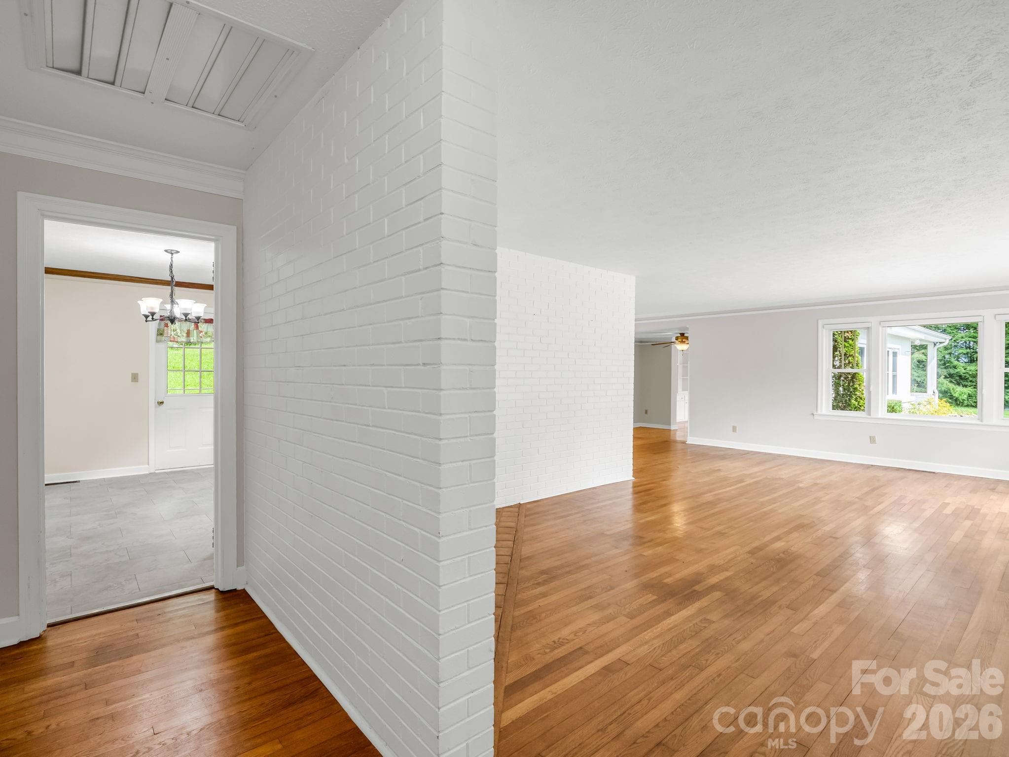 Foyer from front door with living room to the right and kitchen straight ahead - 370 Orchard Circle, Laurel Park