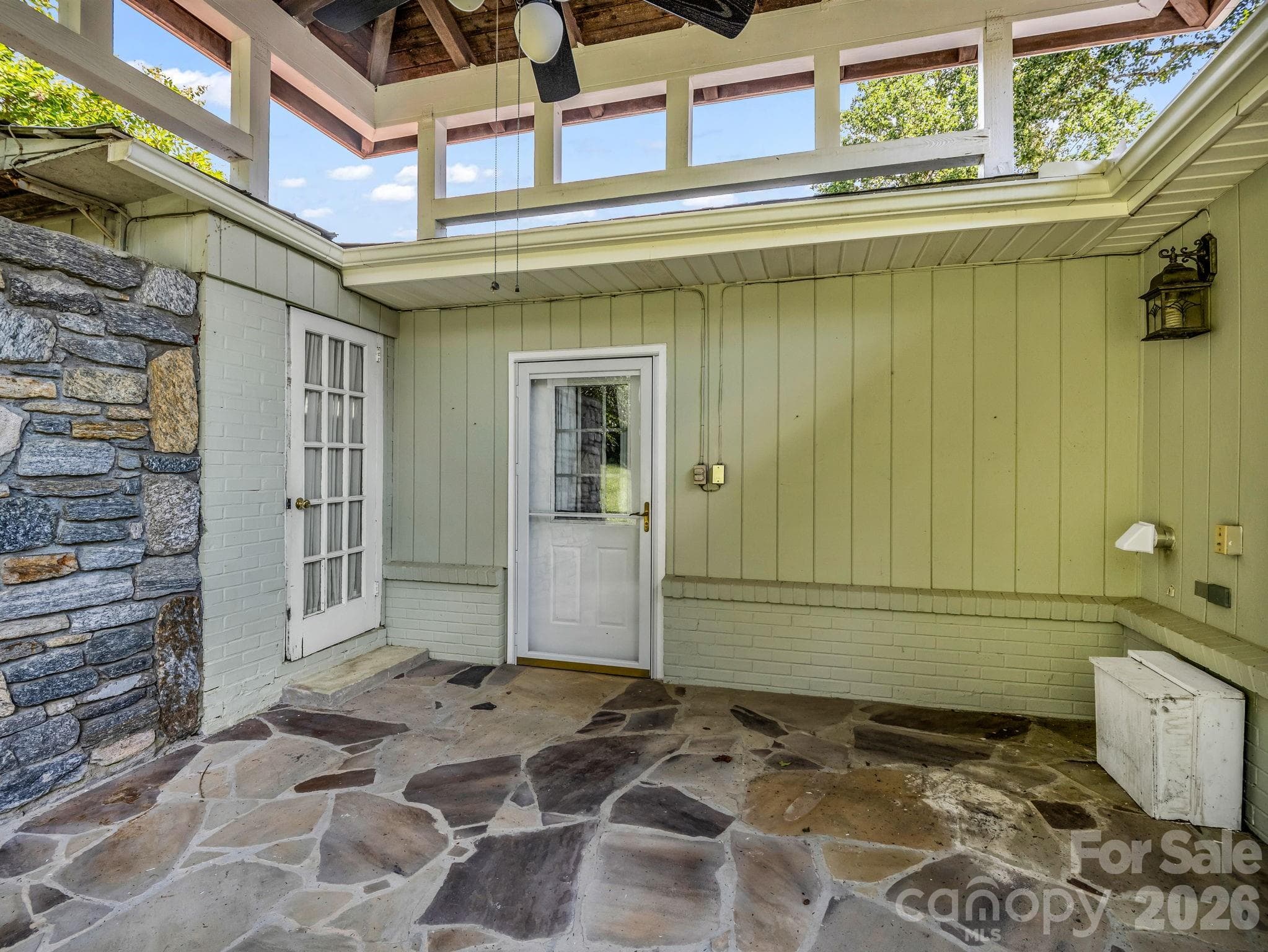 Patio has stone flooring and charm! - 370 Orchard Circle, Laurel Park