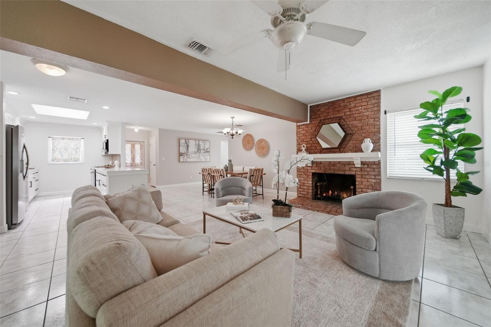 Living room space with fireplace. - 1540 E HORATIO AVE, MAITLAND