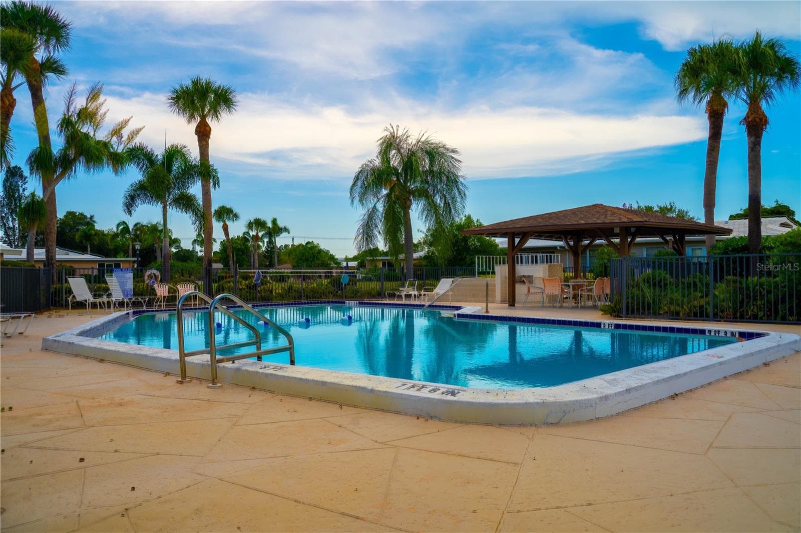 Pool is 20 steps from the back door. - 3289 FAIRHAVEN LN #112, SARASOTA