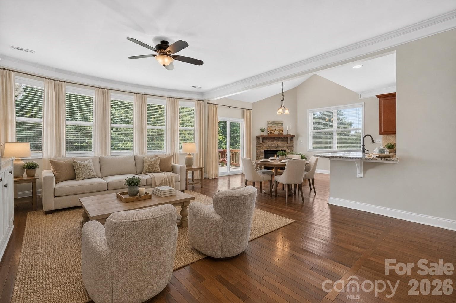 Virtually staged Living room looking into breakfast nook. - Huntersville