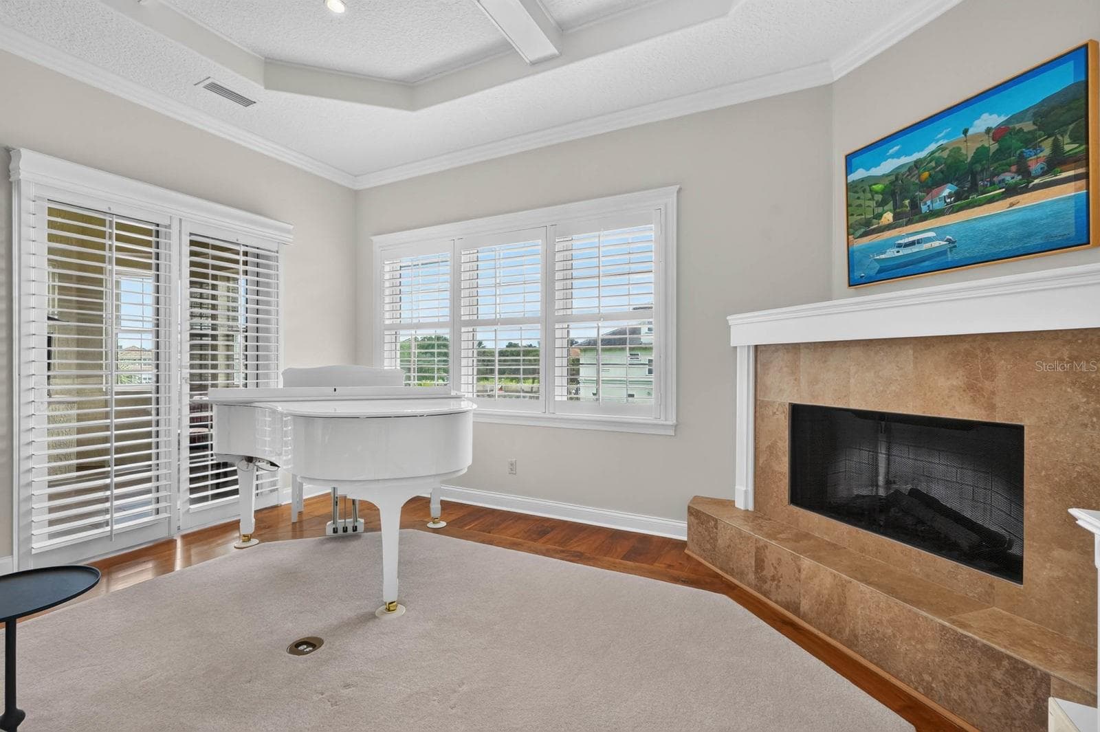 Three levels, three fireplaces... this one brings warmth and character to the heart of the second-floor living space. - 303 YACHT HARBOR DR, PALM COAST