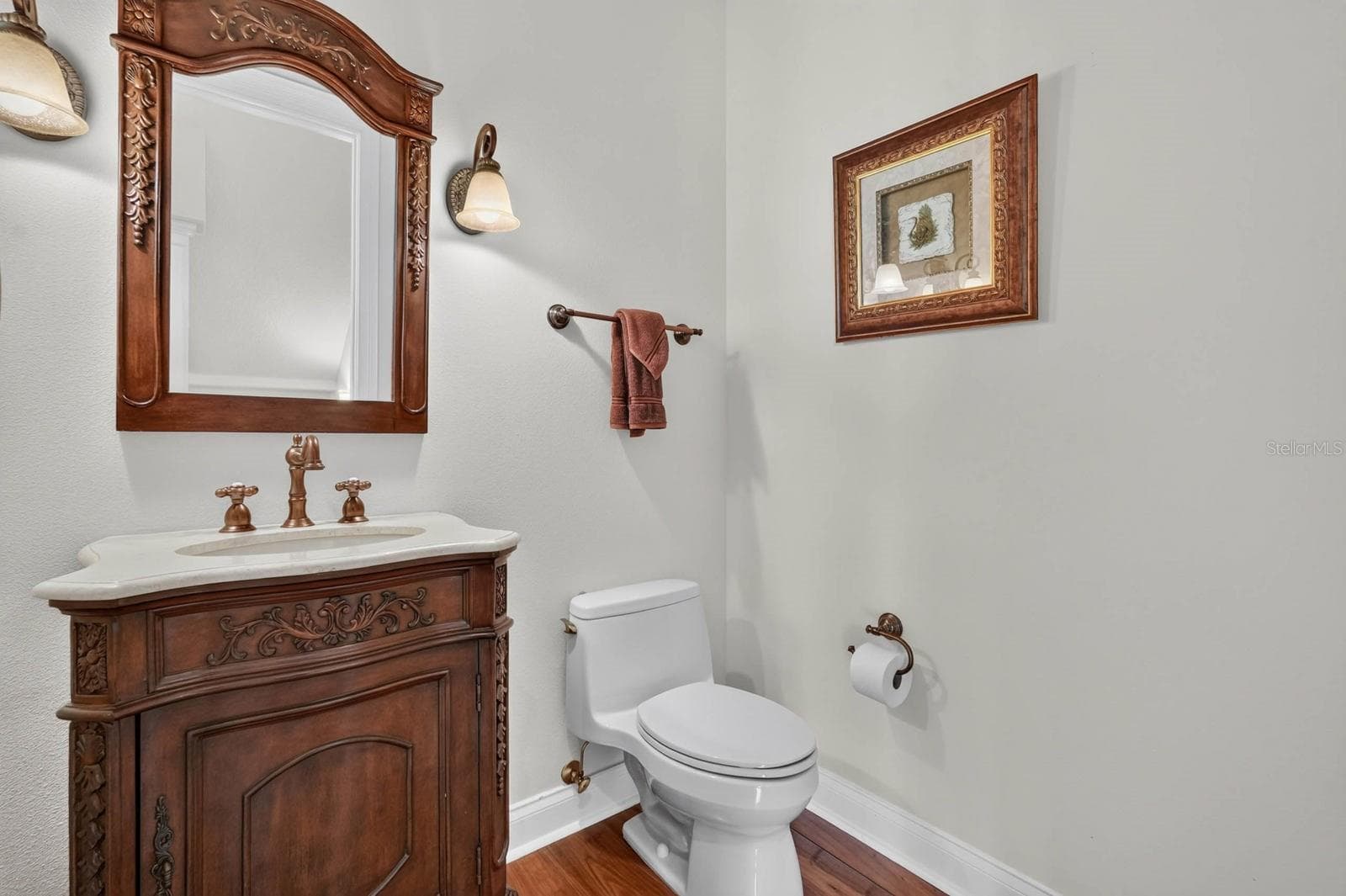 Conveniently positioned for guests, the hall powder bath adds another layer of function to the second floor. - 303 YACHT HARBOR DR, PALM COAST