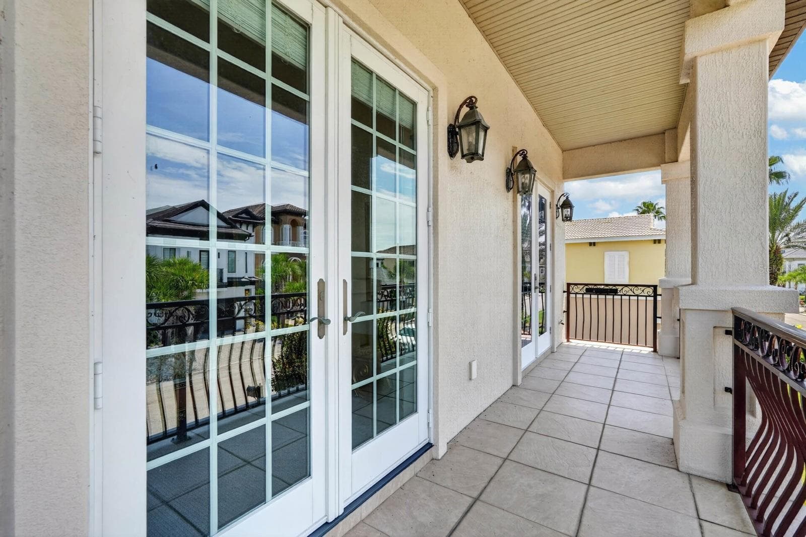 Work or unwind... French doors from both the office and guest bedroom open to this balcony... - 303 YACHT HARBOR DR, PALM COAST