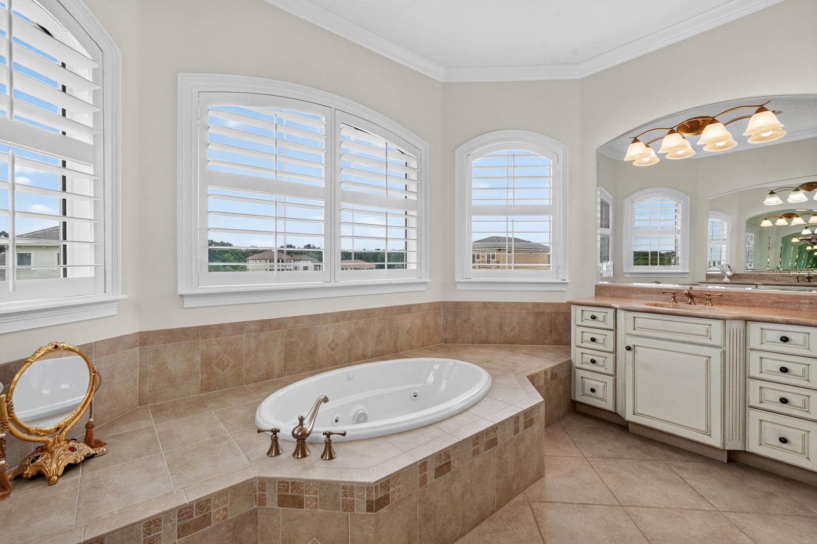 The primary bath was made for unwinding, with a soaking tub at the center of it all - 303 YACHT HARBOR DR, PALM COAST