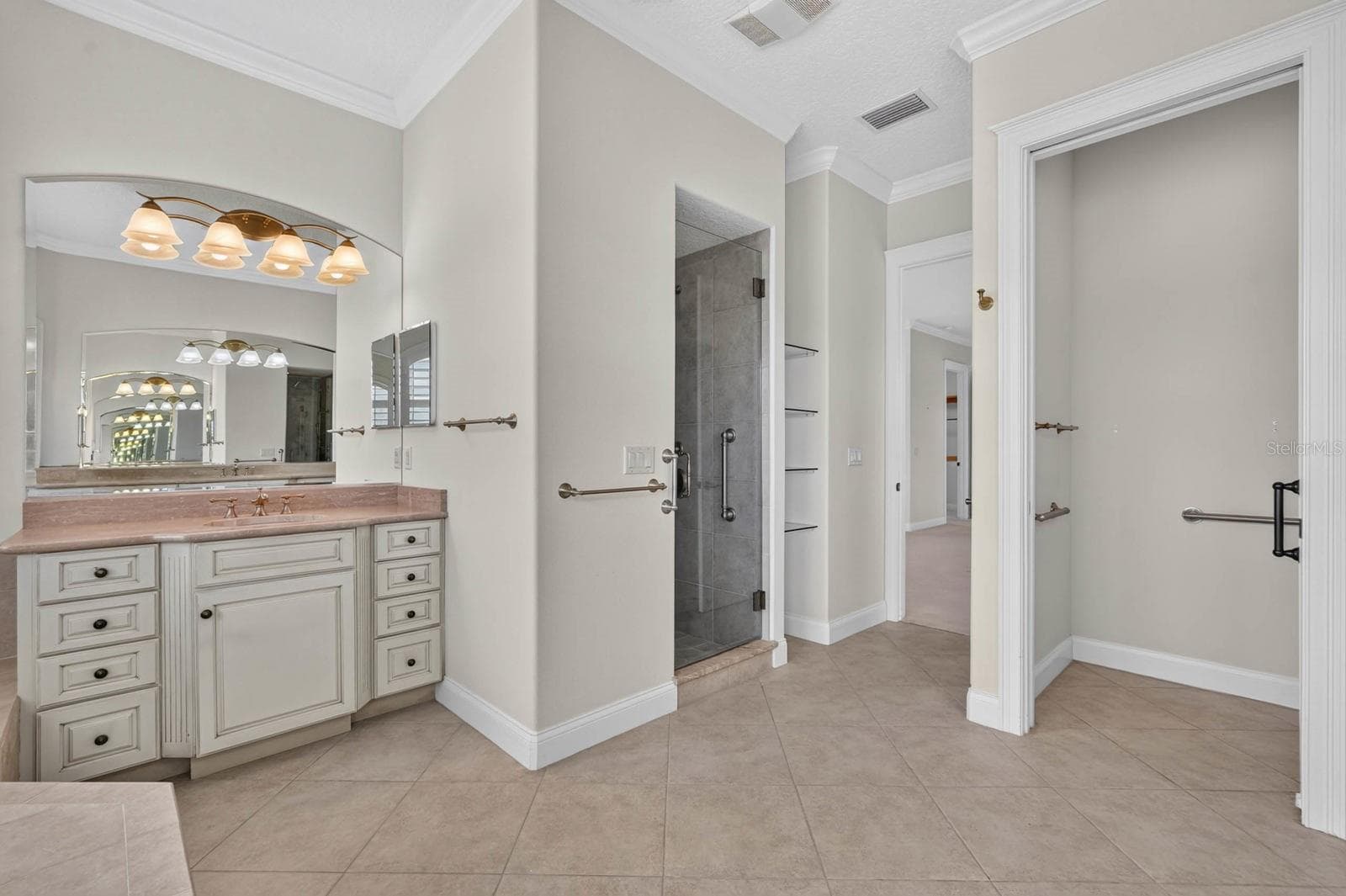 From the soaking tub to the walk-in shower, this primary bath gives you space to choose how the day begins. - 303 YACHT HARBOR DR, PALM COAST