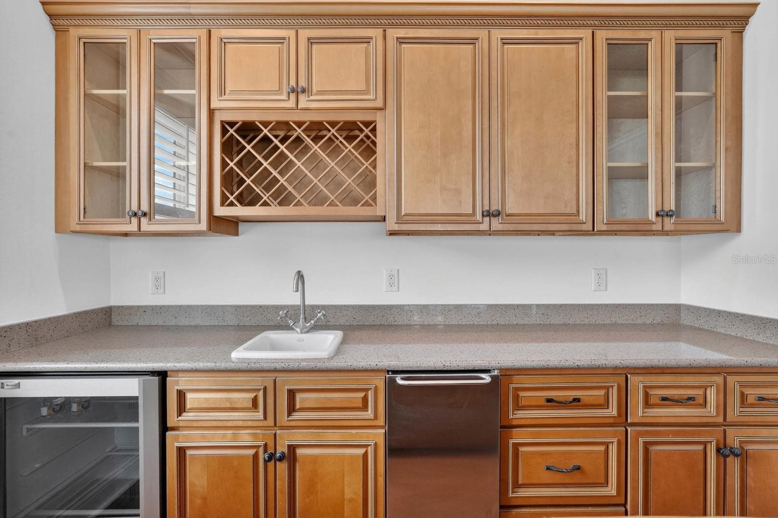 Mix, pour and gather... the wet bar adds another entertaining space to this versatile first floor. - 303 YACHT HARBOR DR, PALM COAST