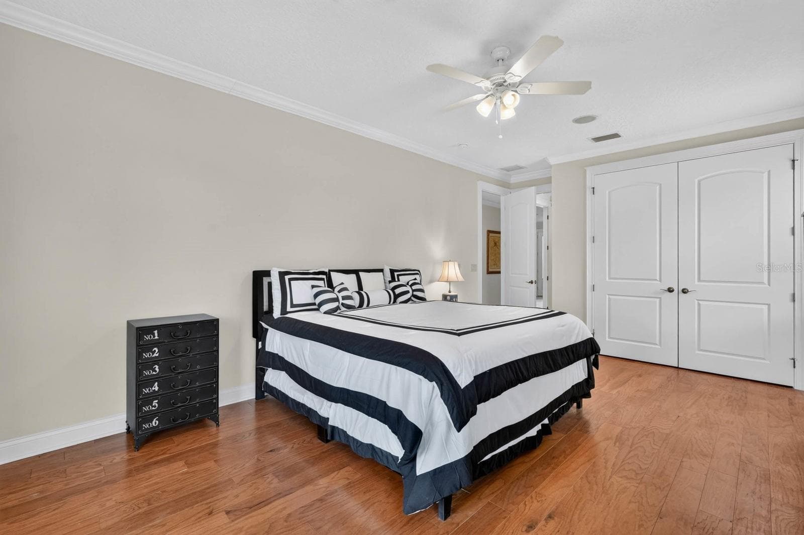 A well proportioned guest room on the 1st floor gives overnight visitors a comfortable space away from the main living areas. - 303 YACHT HARBOR DR, PALM COAST