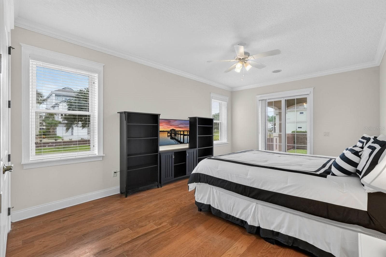A guest room with a little something extra... French doors leading directly outside. - 303 YACHT HARBOR DR, PALM COAST