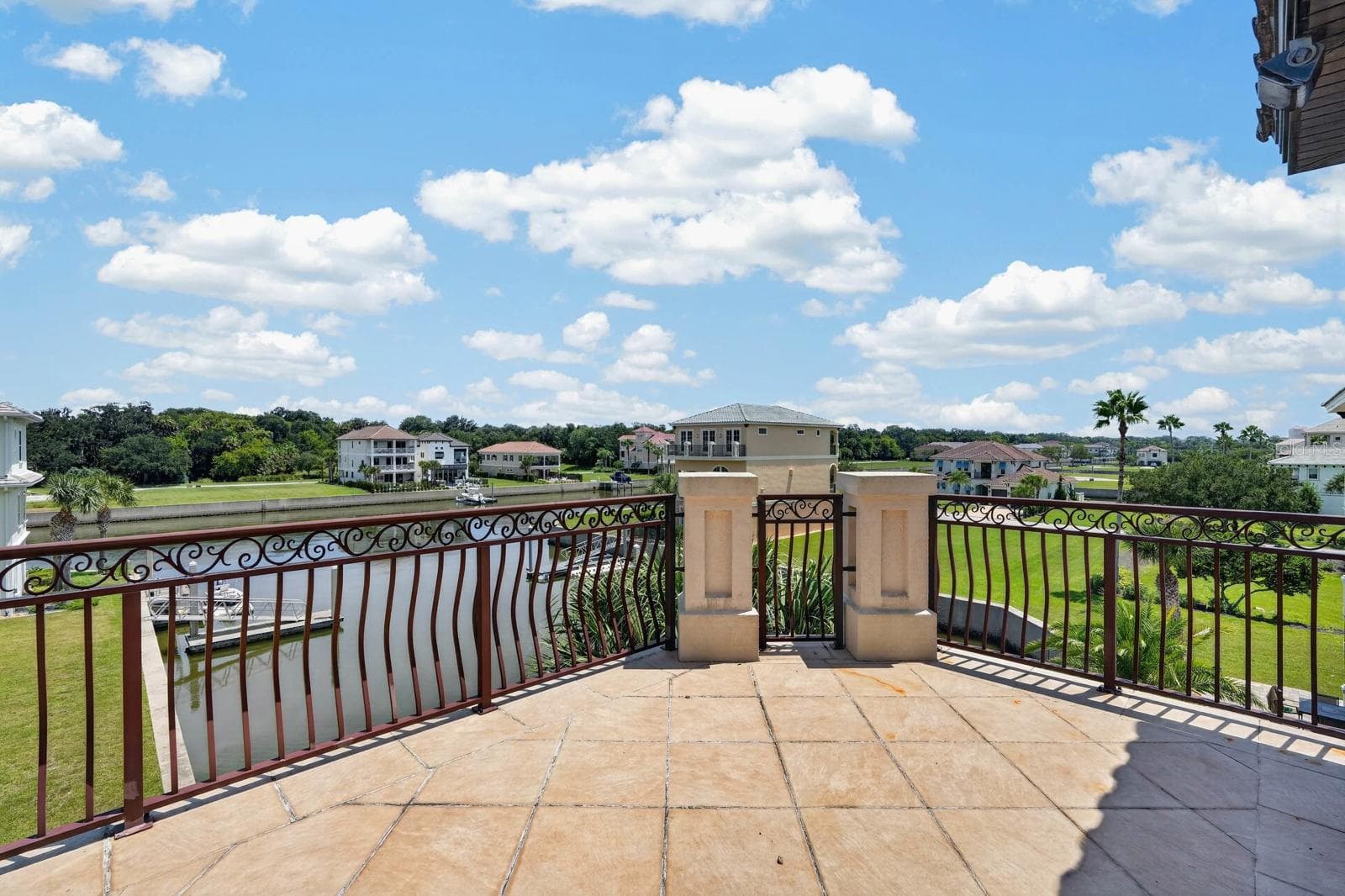Outdoor living isn’t limited to the ground floor... multiple balconies and verandas invite you to step outside and take it all in. - 303 YACHT HARBOR DR, PALM COAST