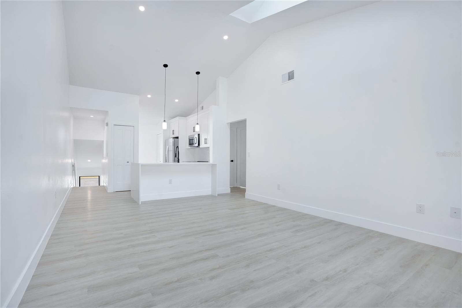 Vaulted ceilings enhance the spacious and airy feel of the main living area. - 3012 S SEMORAN BLVD #G2, ORLANDO