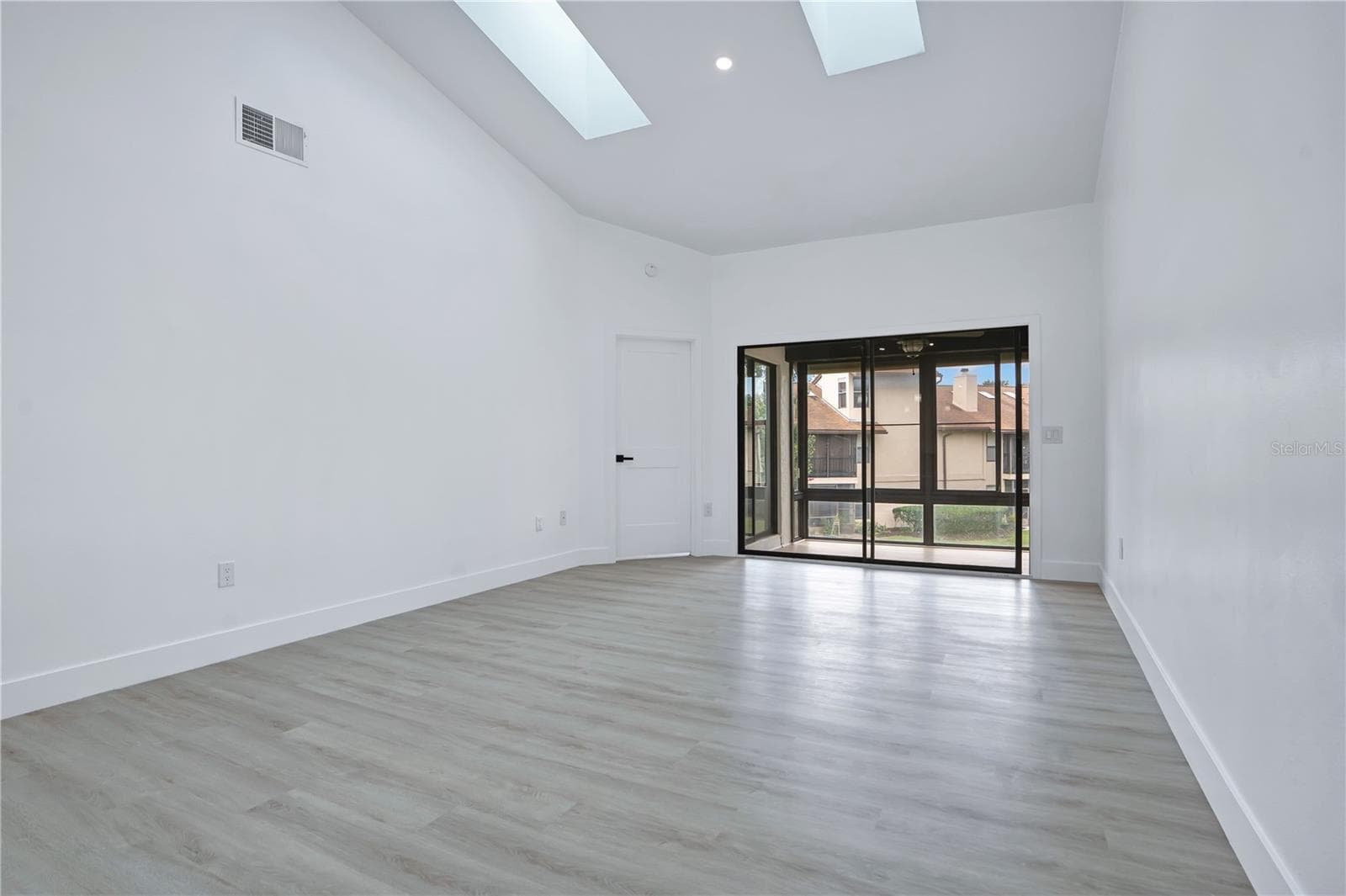 Vaulted ceilings enhance the spacious and airy feel of the main living area. - 3012 S SEMORAN BLVD #G2, ORLANDO