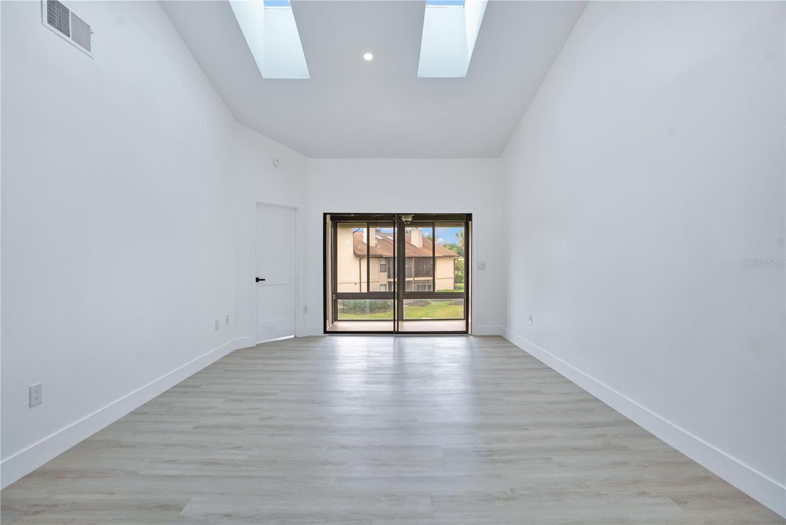 Vaulted ceilings enhance the spacious and airy feel of the main living area. - 3012 S SEMORAN BLVD #G2, ORLANDO