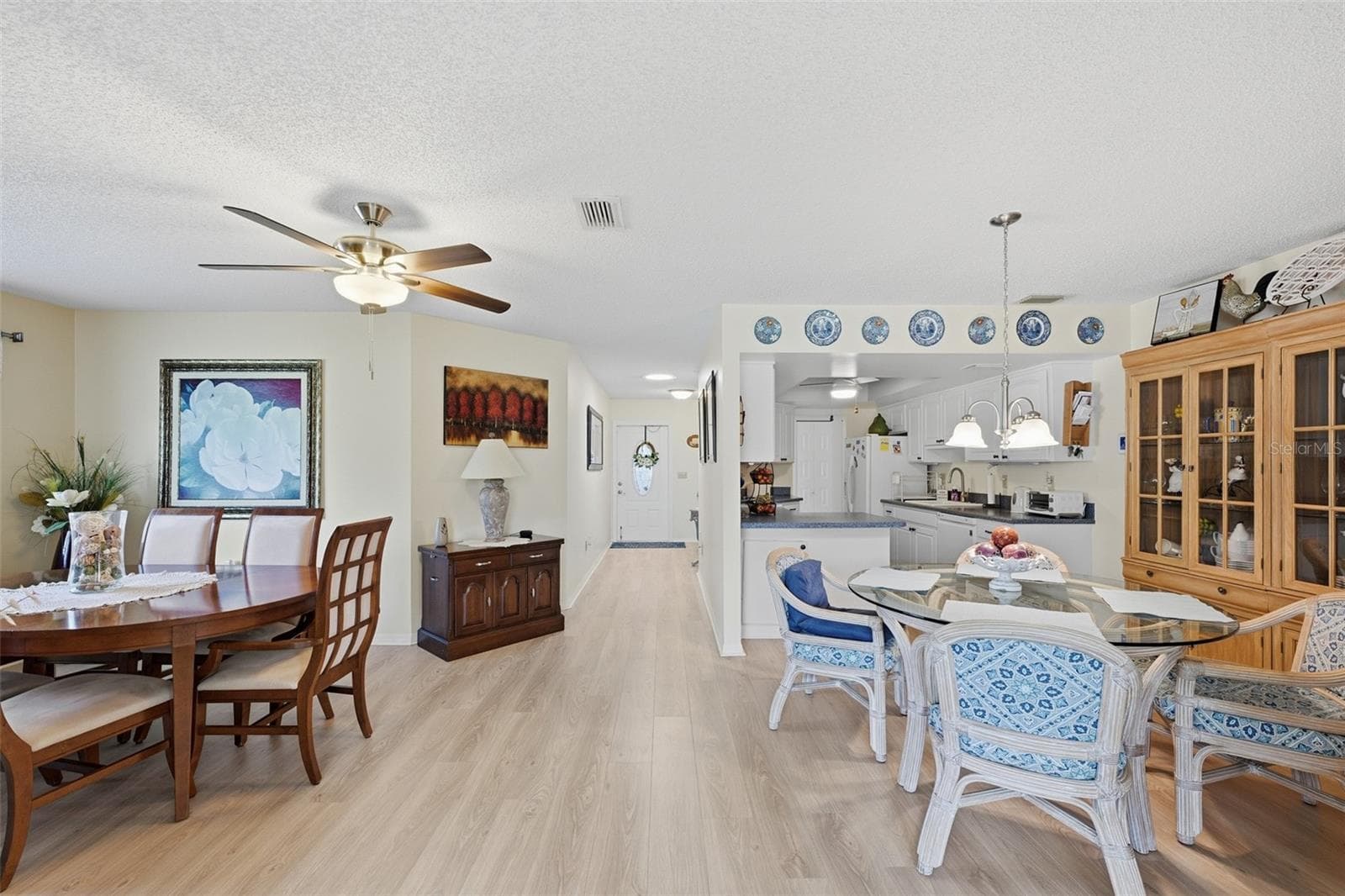 Dining Room on left, Dinette area & Kitchen beyond - 2005 HEATHFIELD CIR #241, SUN CITY CENTER