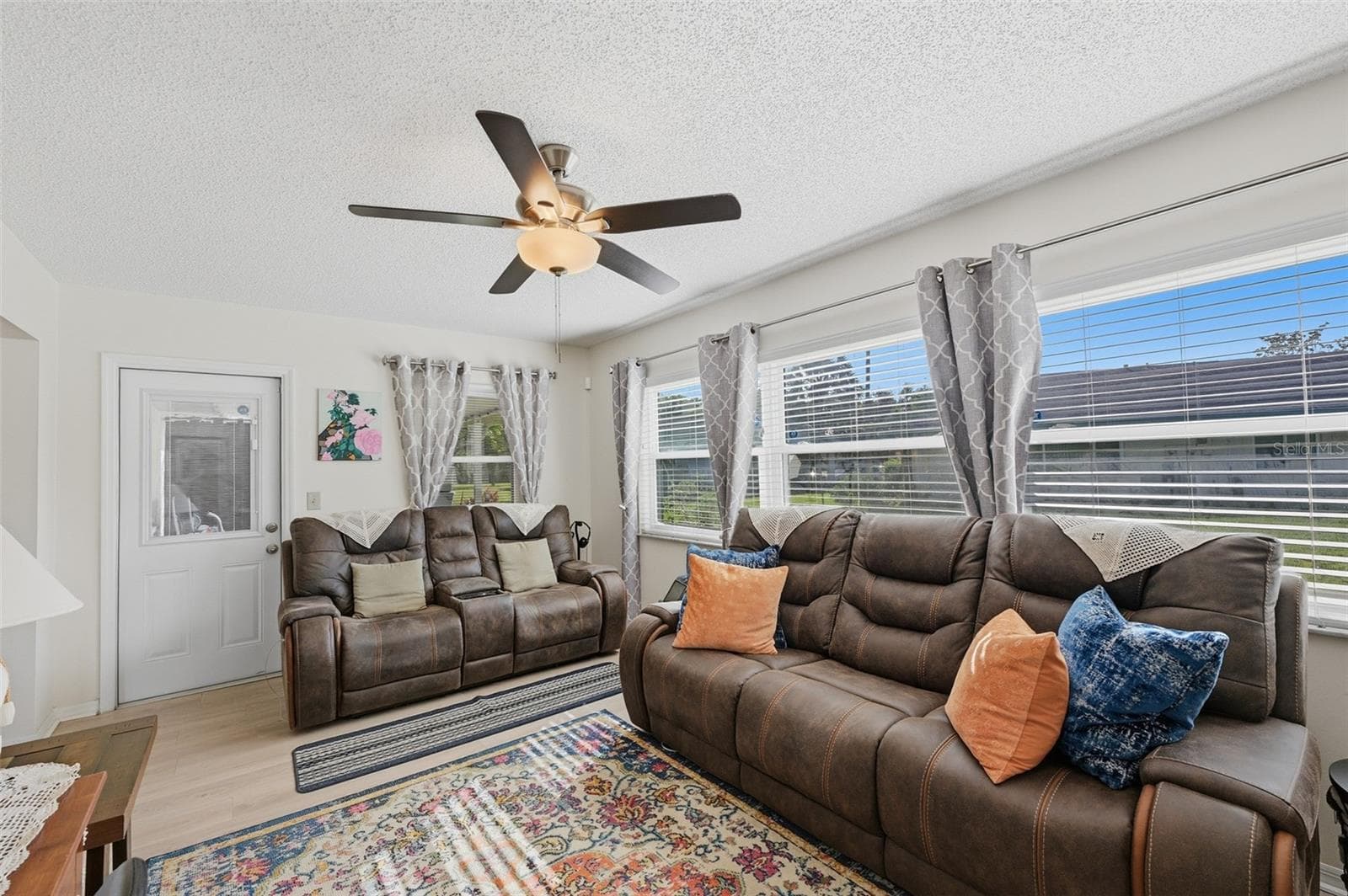 Family room w/door leading to covered, screened Lanai - 2005 HEATHFIELD CIR #241, SUN CITY CENTER