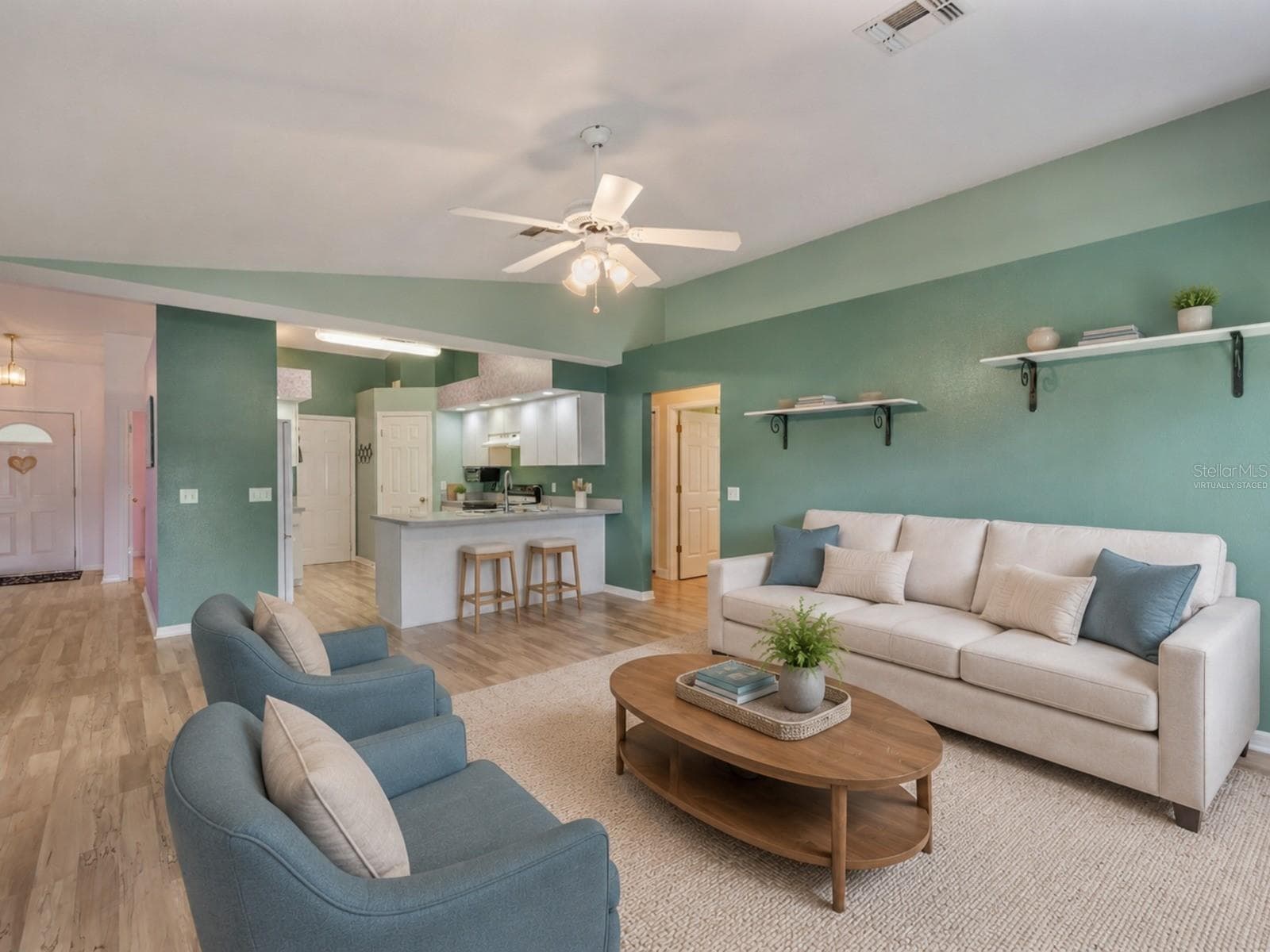 Family Room opened to the kitchen - Virtually Staged to enhance experience. - 1660 GAMEWELL TRL, LAKELAND