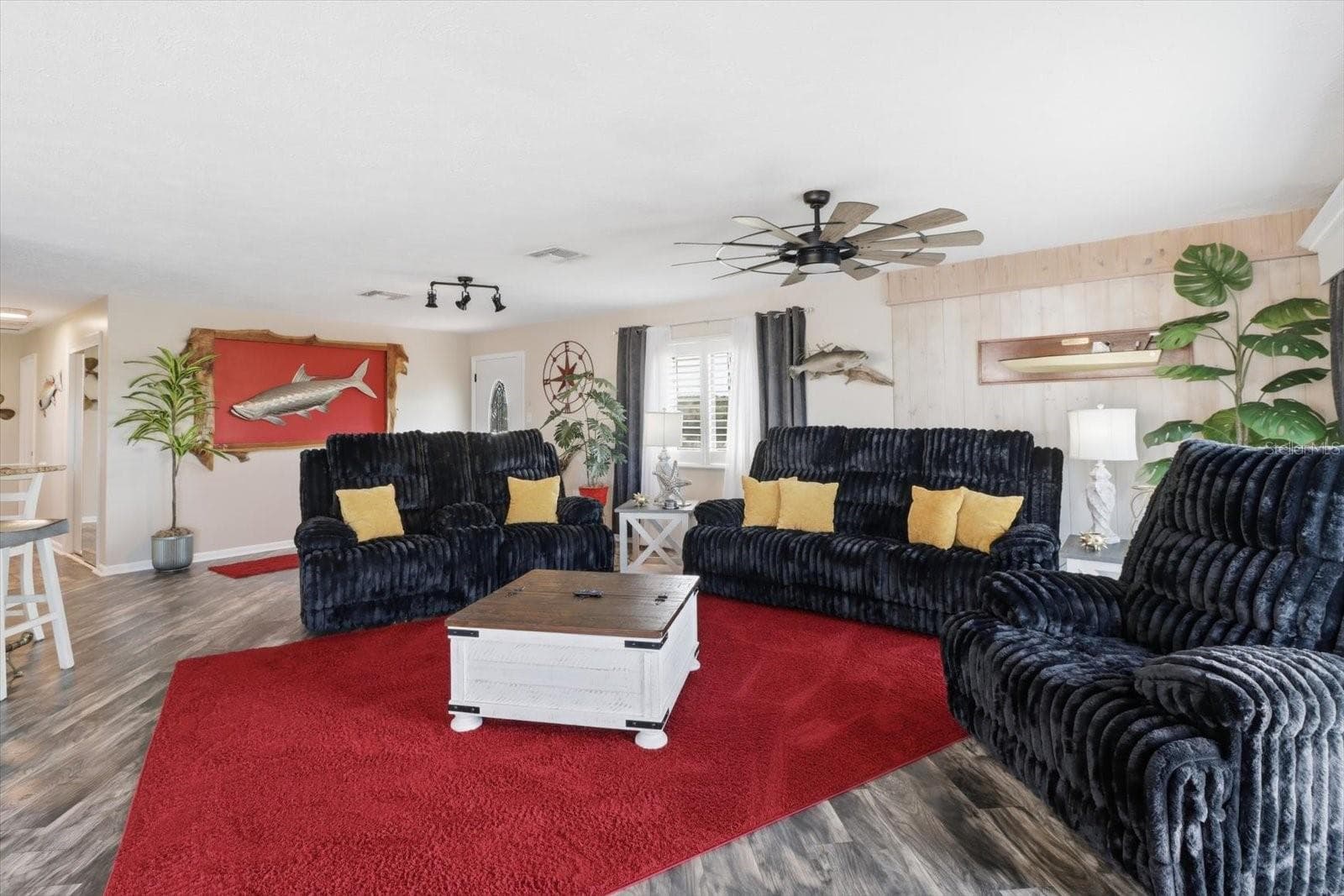 Main living room with open-concept layout and coastal décor. - 3198 INDIAN GULF LN, HERNANDO BEACH