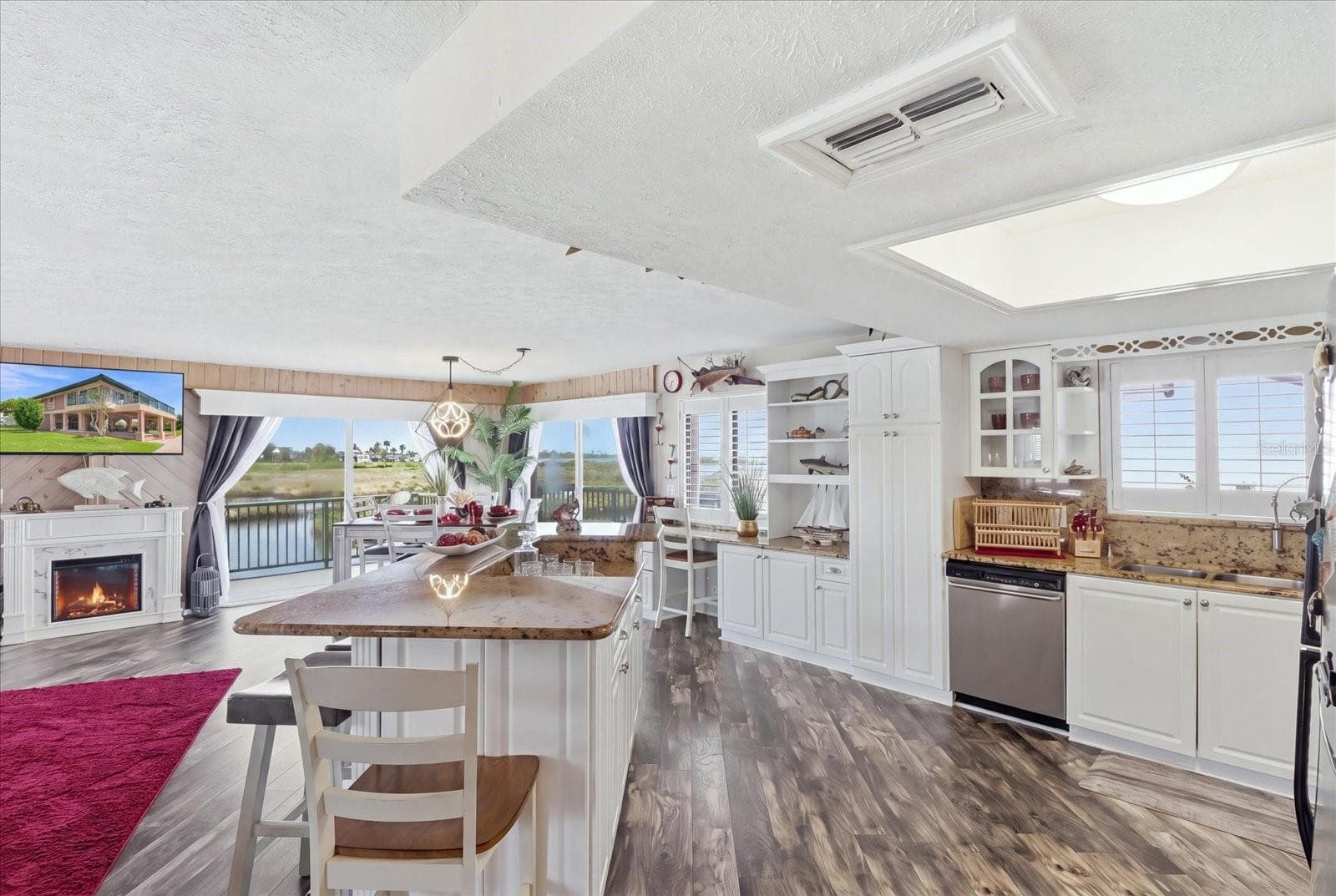 Kitchen and dining area positioned to take advantage of waterfront views. - 3198 INDIAN GULF LN, HERNANDO BEACH