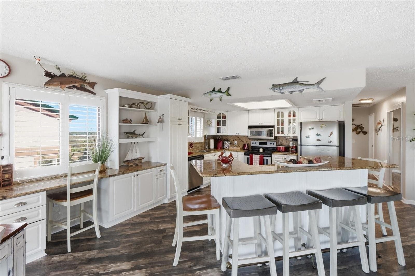 Kitchen and breakfast bar providing abundant seating and workspace. - 3198 INDIAN GULF LN, HERNANDO BEACH
