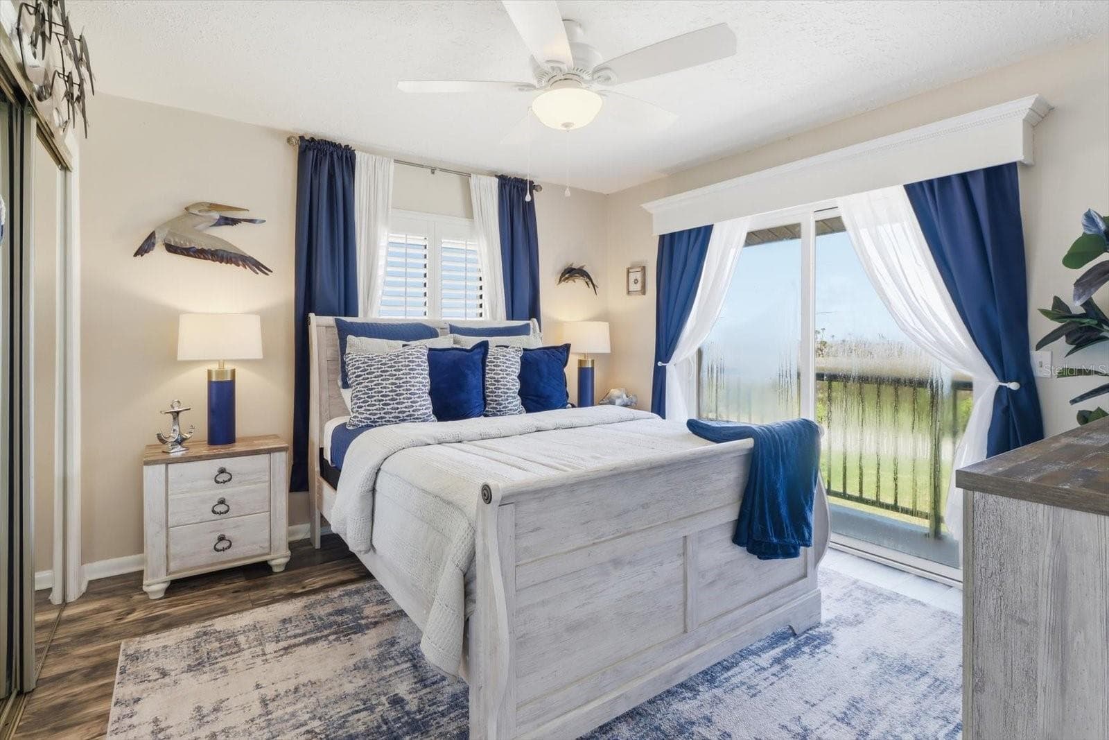 Guest bedroom with direct access to the waterfront balcony. - 3198 INDIAN GULF LN, HERNANDO BEACH