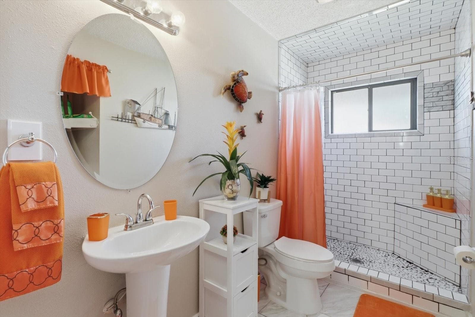 Updated bathroom featuring a tiled walk-in shower. - 3198 INDIAN GULF LN, HERNANDO BEACH