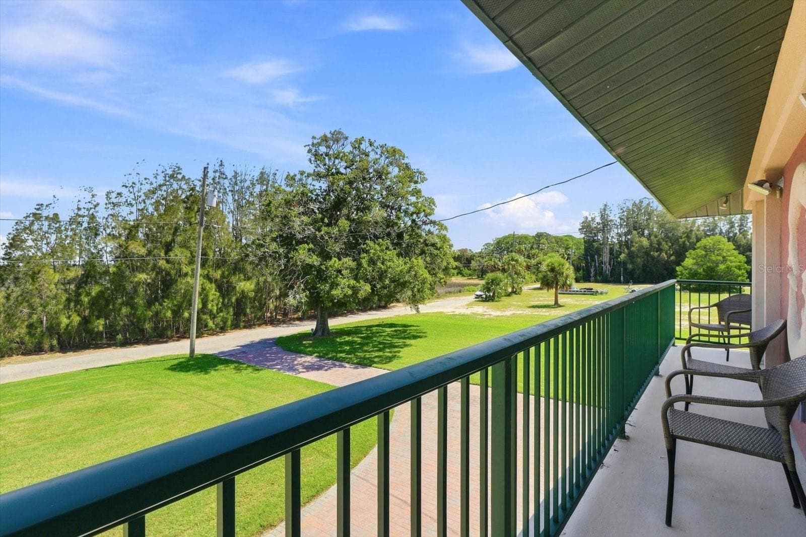Balcony View – Grounds, Waterfront & Neighboring Residence - 3198 INDIAN GULF LN, HERNANDO BEACH