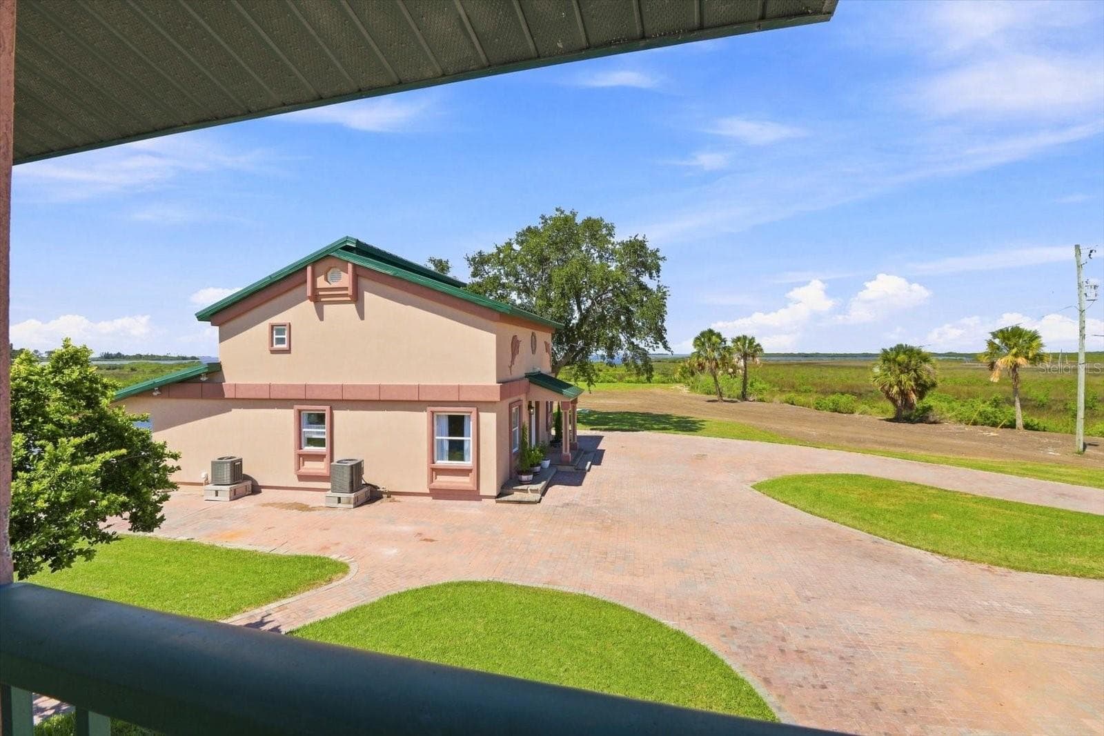 Grounds & Coastal Setting – Neighboring Residence Beyond - 3198 INDIAN GULF LN, HERNANDO BEACH