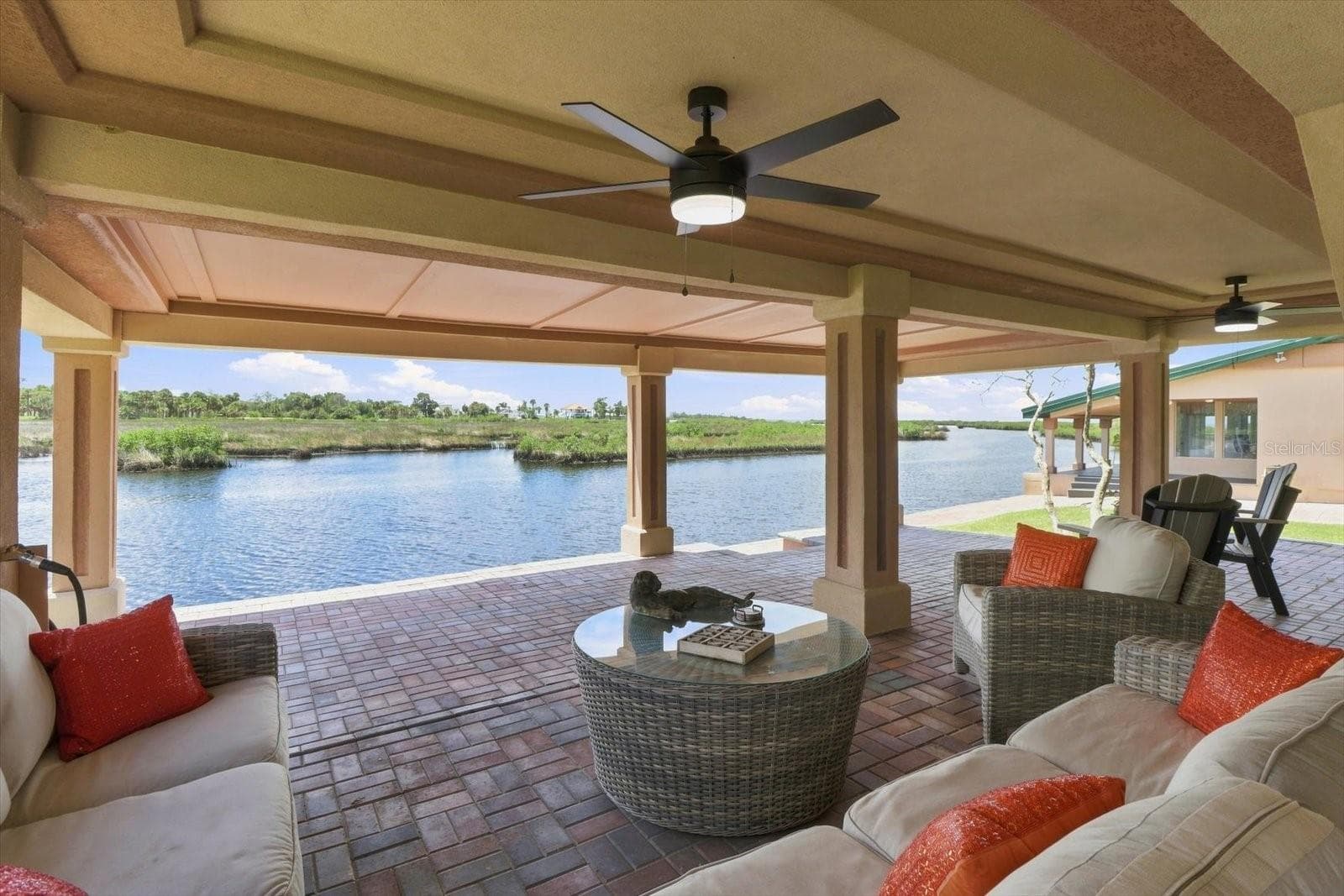 Outdoor living area positioned directly along the waterfront. - 3198 INDIAN GULF LN, HERNANDO BEACH