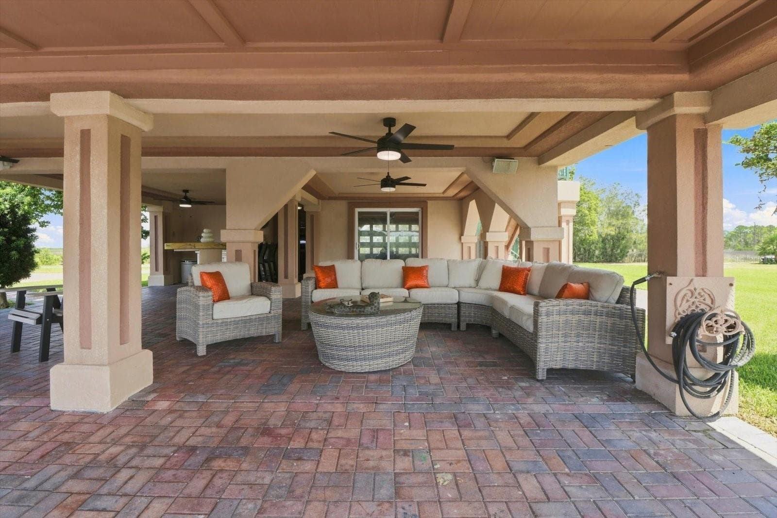 Alternate view showcasing the scale of the covered entertainment space. - 3198 INDIAN GULF LN, HERNANDO BEACH