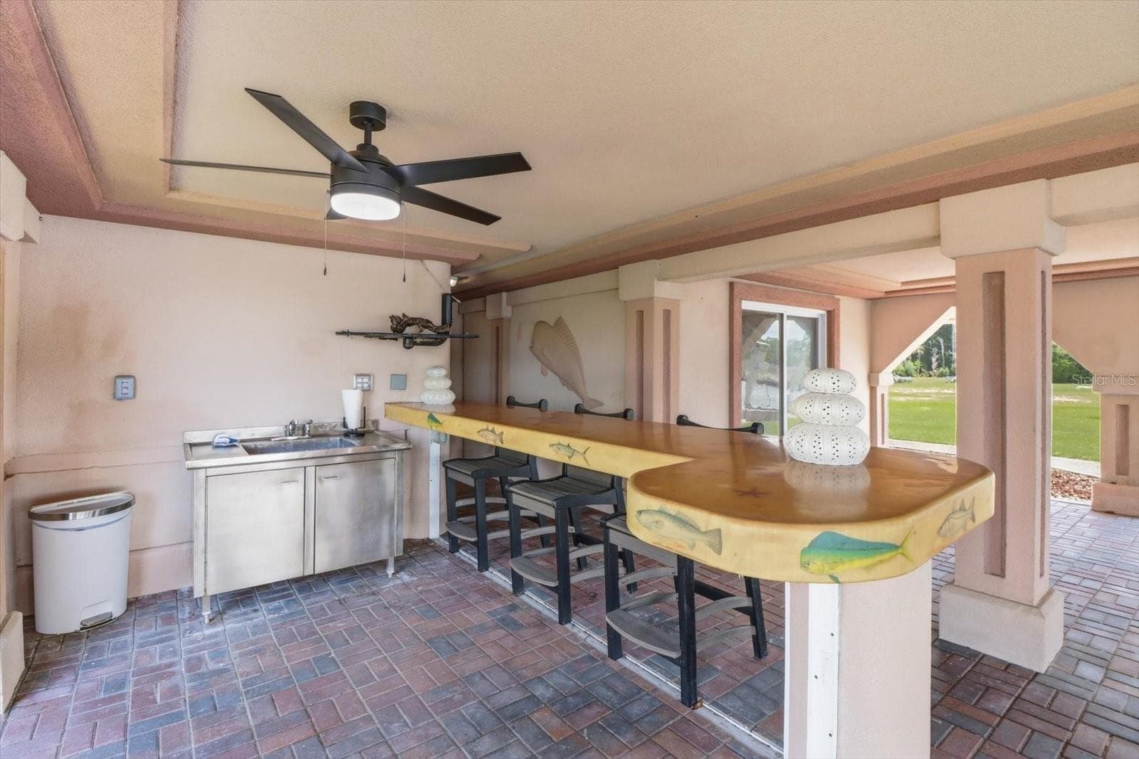 Outdoor bar area with stainless sink and generous counter space. - 3198 INDIAN GULF LN, HERNANDO BEACH
