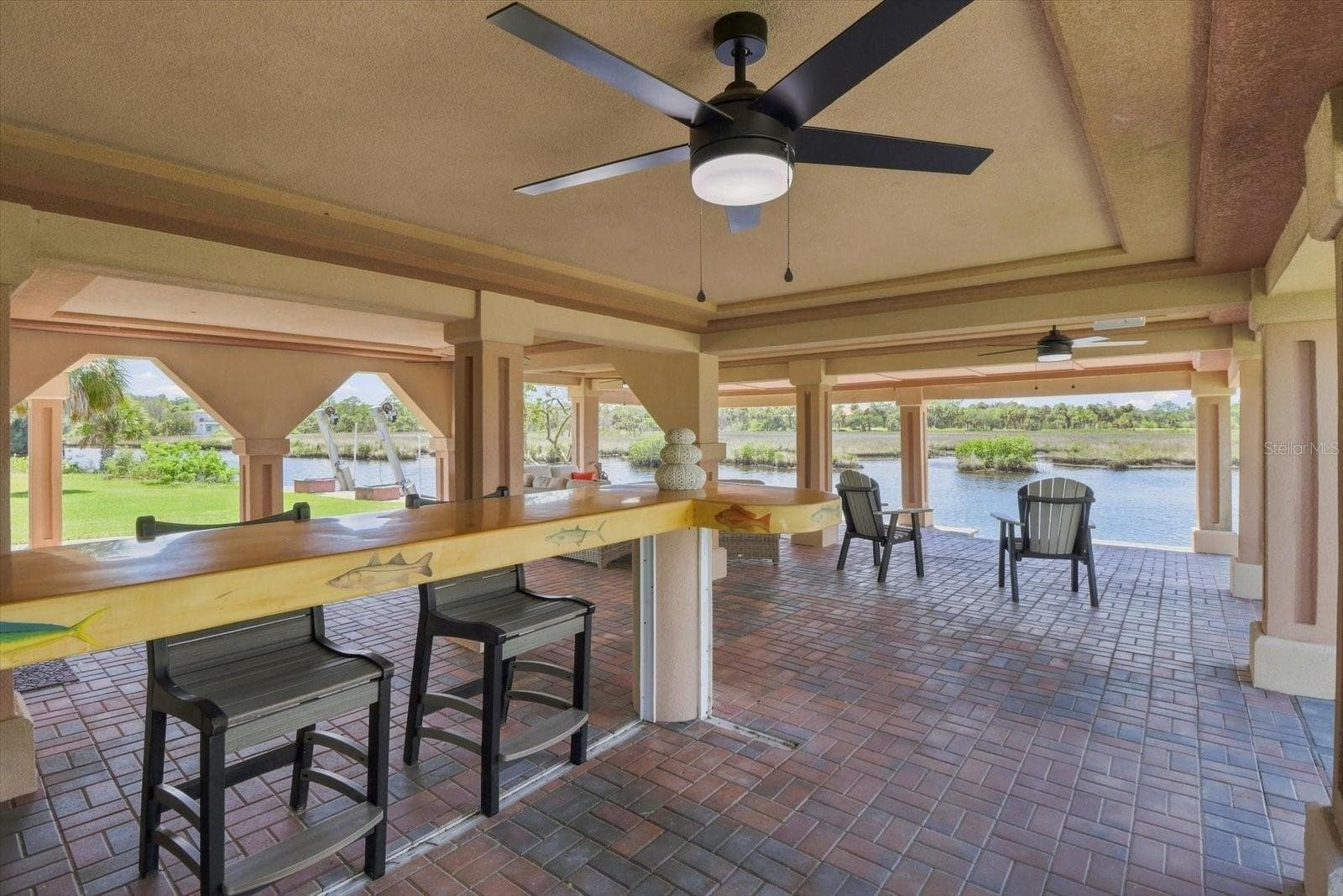 Waterfront-oriented outdoor bar and entertaining area. - 3198 INDIAN GULF LN, HERNANDO BEACH