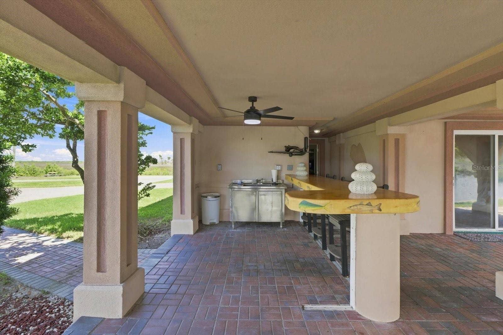 Wide view of the covered bar and adjoining outdoor living space. - 3198 INDIAN GULF LN, HERNANDO BEACH