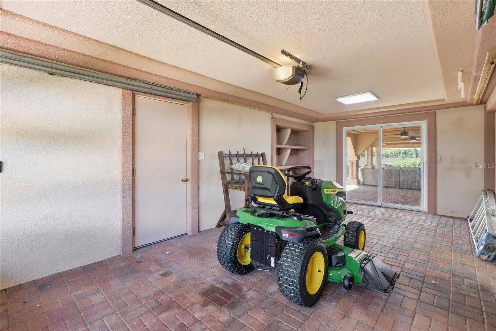 Ground-level garage and storage area. - 3198 INDIAN GULF LN, HERNANDO BEACH