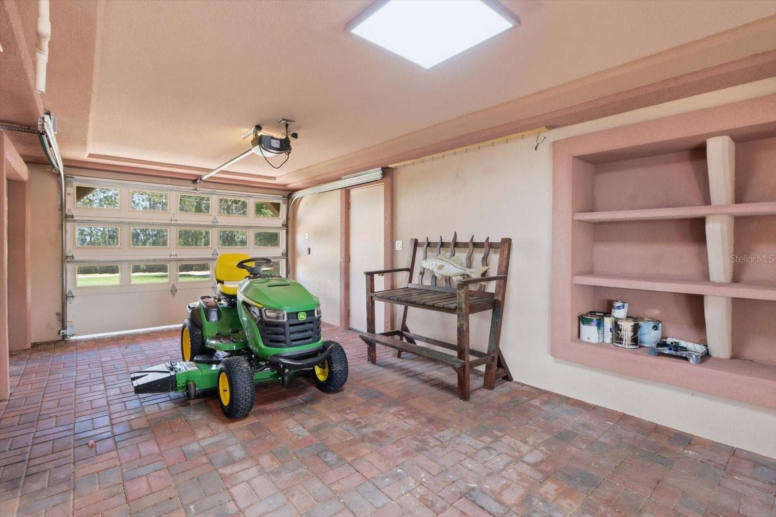 Alternate garage view showing additional storage and direct exterior access. - 3198 INDIAN GULF LN, HERNANDO BEACH