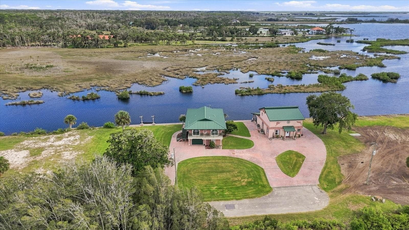 Expansive aerial showing the property surrounded by natural wetlands and waterways. - 3198 INDIAN GULF LN, HERNANDO BEACH