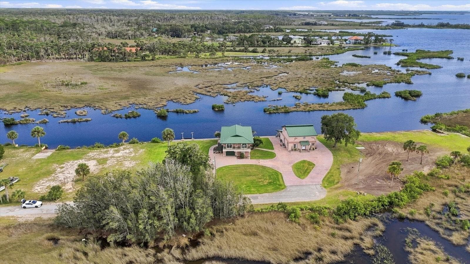 High aerial view toward the Gulf of America across the undeveloped coastal marshlands. - 3198 INDIAN GULF LN, HERNANDO BEACH