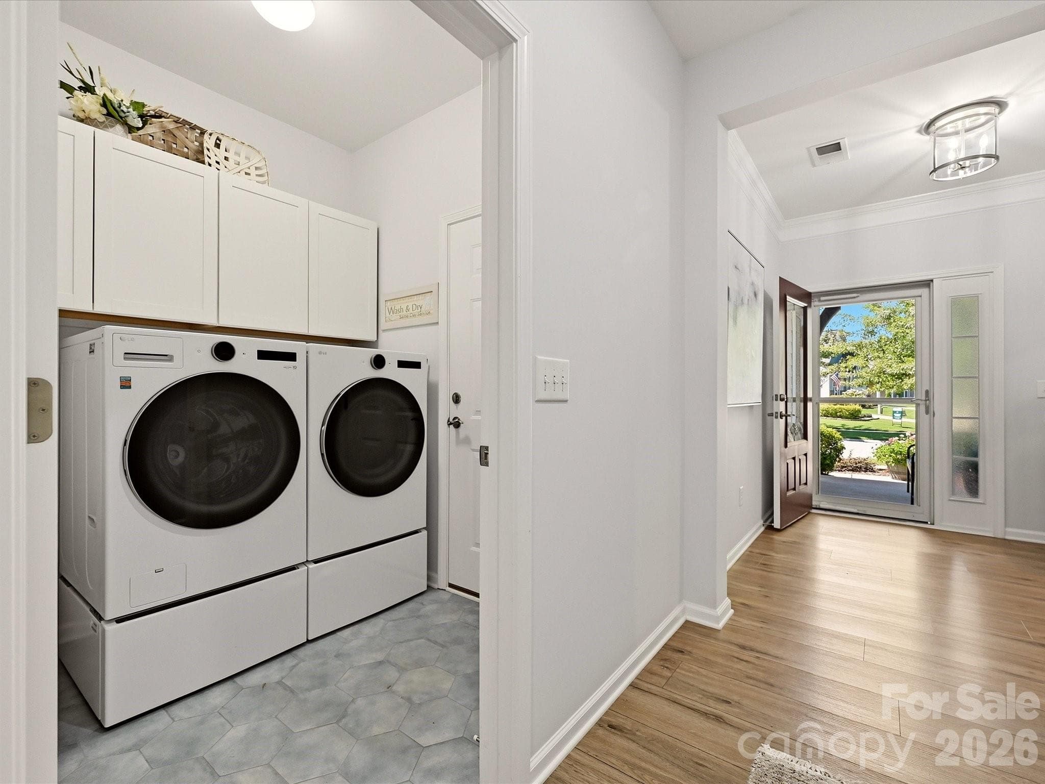 Laundry Room with New Flooring and Cabinets added over appliances - 5060 Big Bend Drive, Lancaster