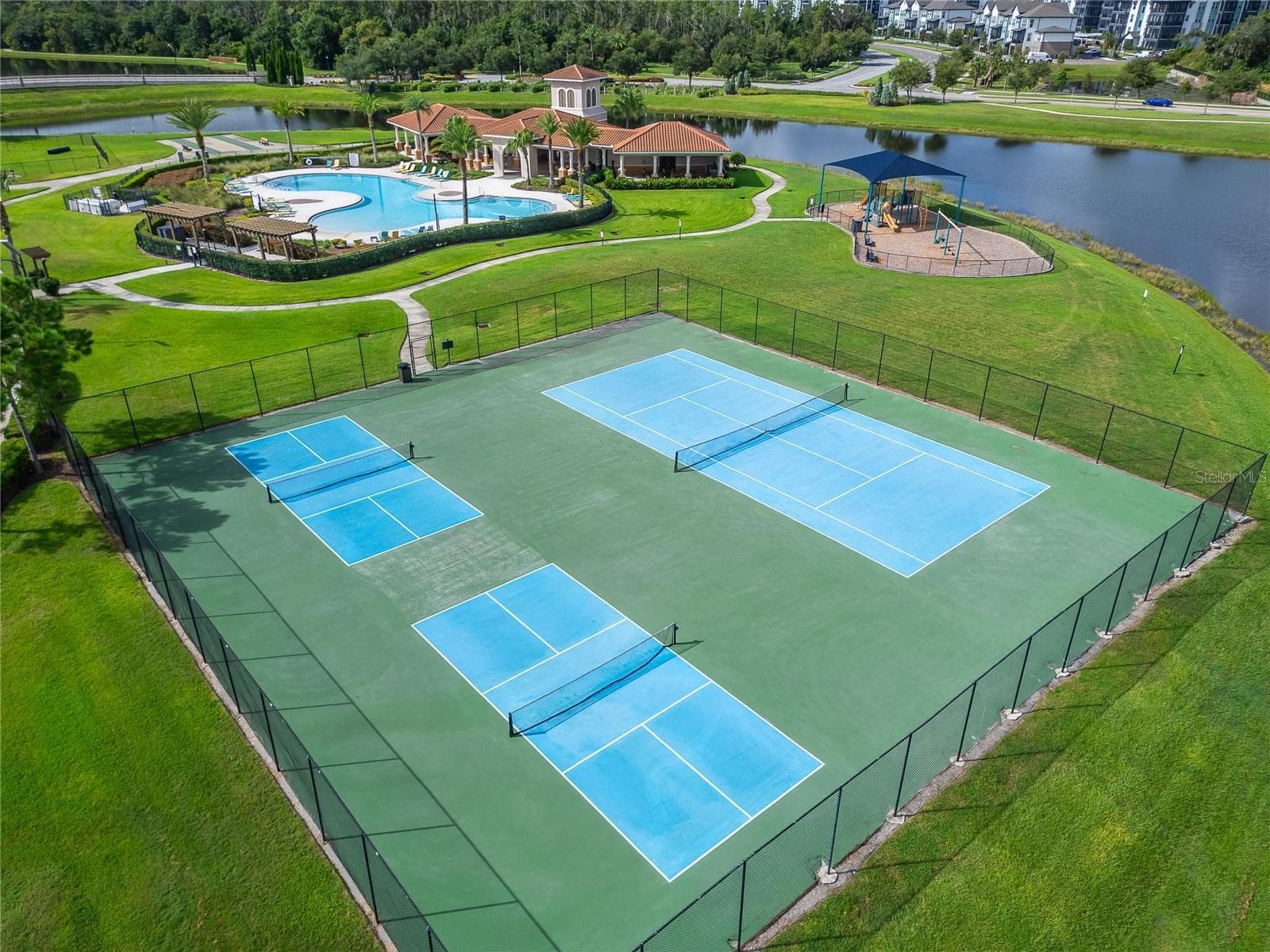 Enjoy a gated community with an impressive selection of amenities, including a resort-style pool, clubhouse, pickleball and tennis courts, playground, dog park, shuffleboard, basketball court and walking trails. - 5035 SABLE CHIME DR, WIMAUMA