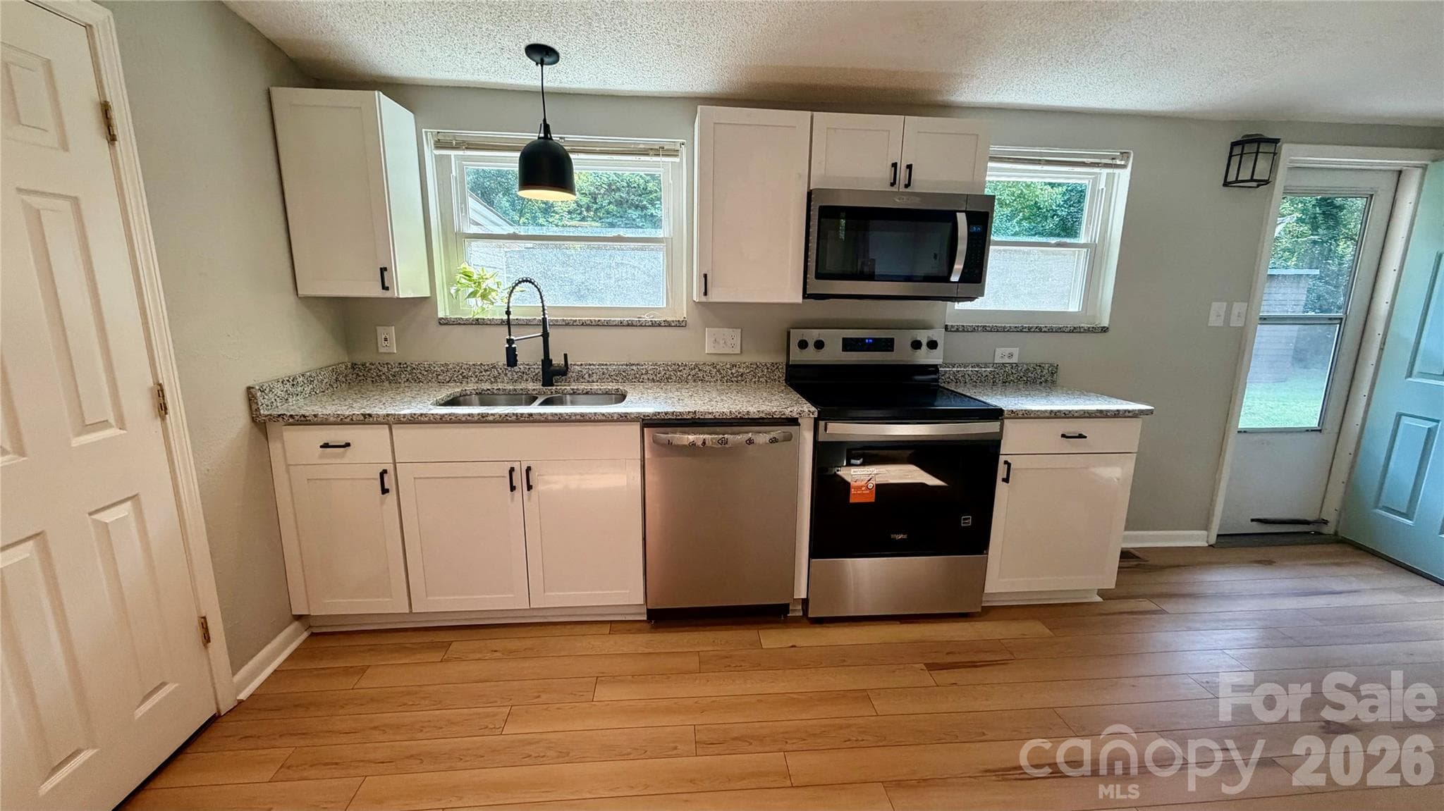 bright natural lighting fills the kitchen & living room - 216 Auten Circle, Mount Holly