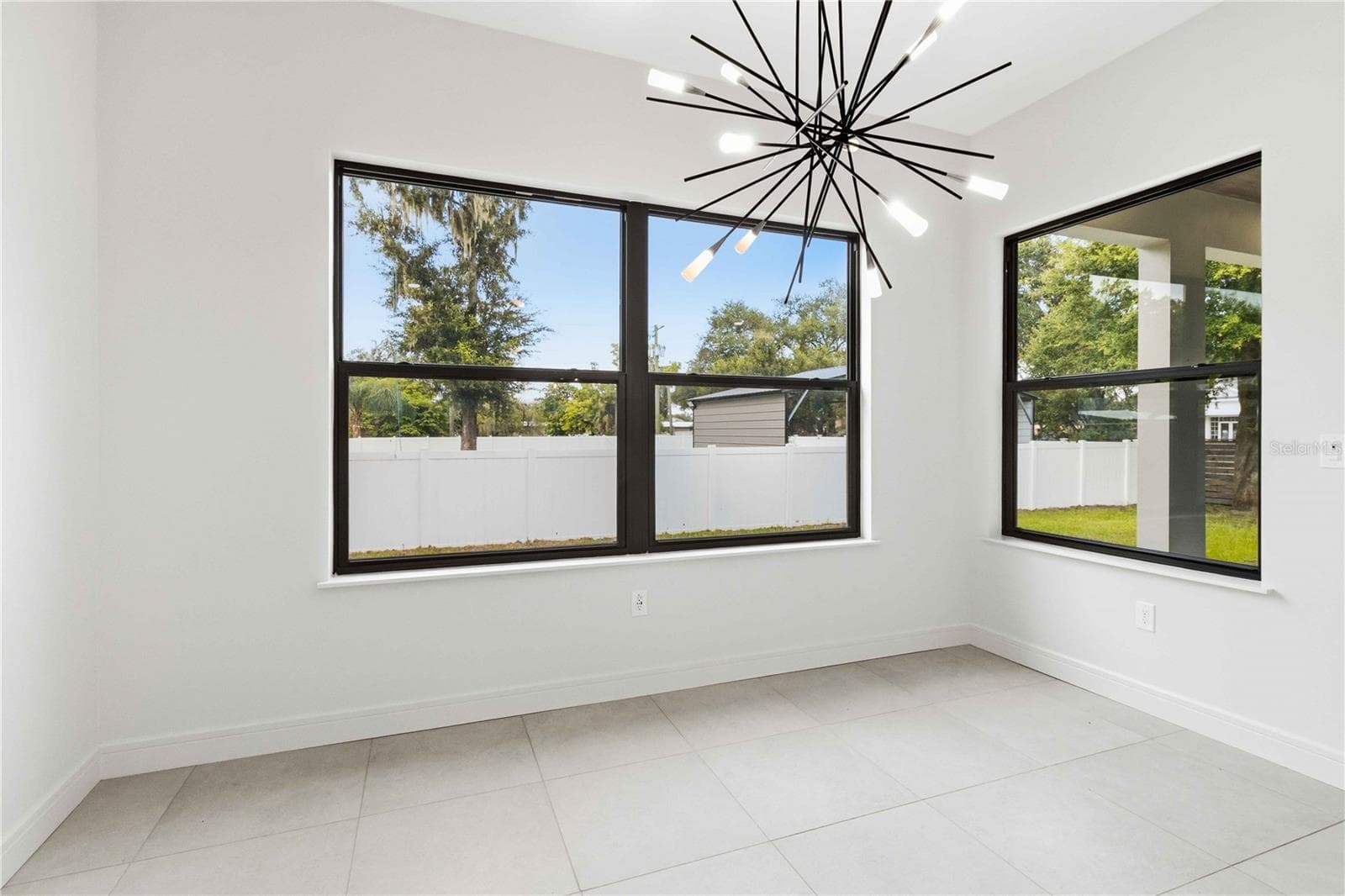 Striking pendant lighting and an adjoining dining area complete a space designed for everything from quiet weekday meals to lively gatherings - 104 S MAKI RD, PLANT CITY