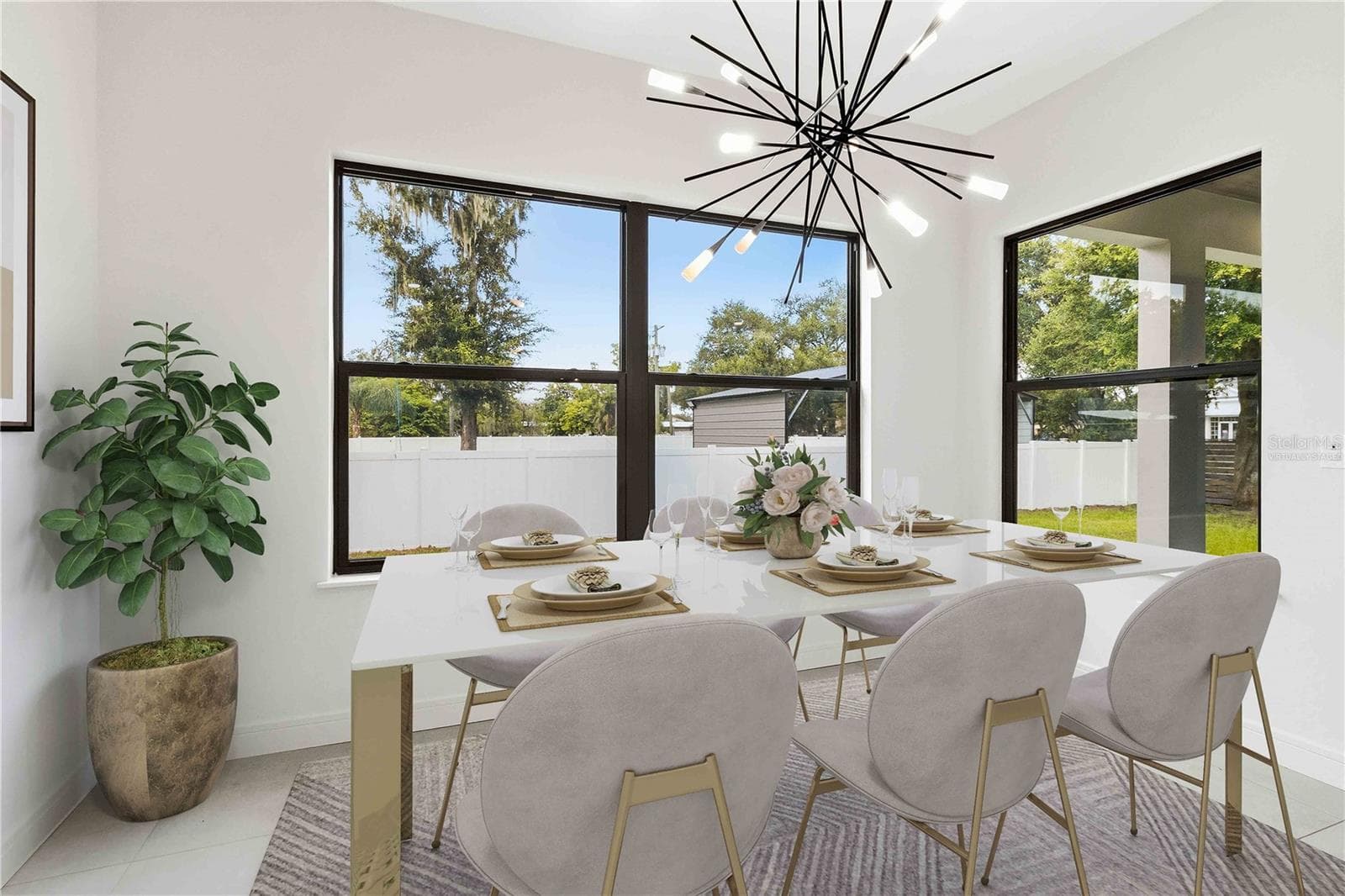 Virtually Staged Image of Striking pendant lighting and an adjoining dining area complete a space designed for everything from quiet weekday meals to lively gatherings - 104 S MAKI RD, PLANT CITY