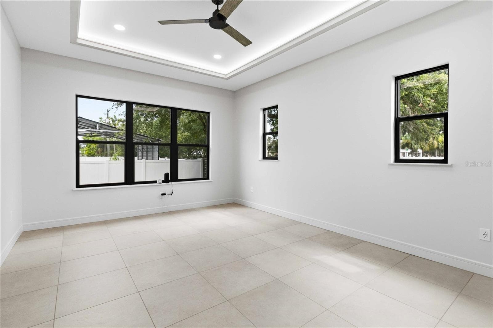 Privately positioned in its own wing, the spacious primary suite provides a tranquil escape with an impressive walk-in closet and a spa-inspired bathroom - 104 S MAKI RD, PLANT CITY