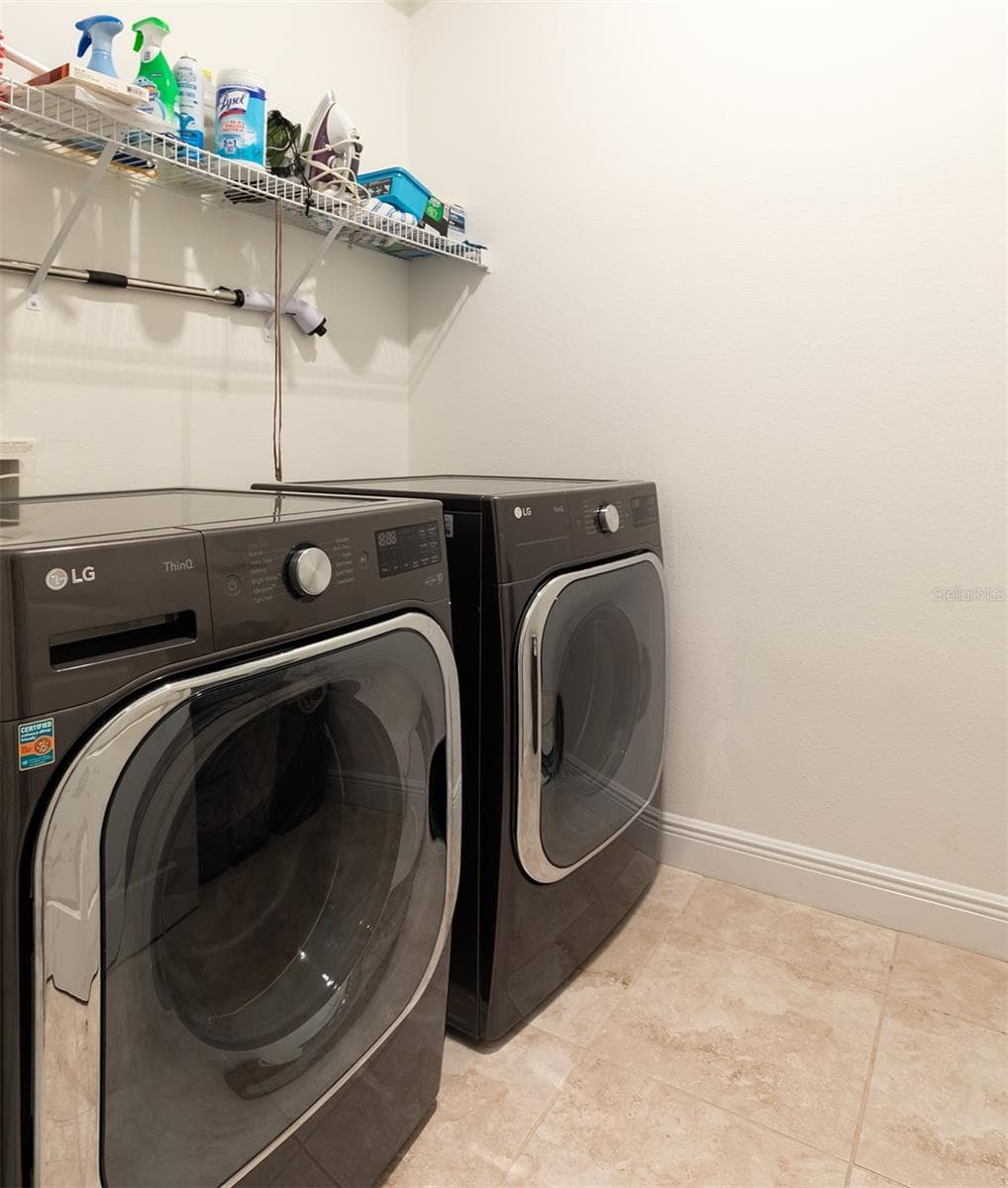 Inside laundry room is downstairs off the garage - 995 KARST TREE LN, APOPKA