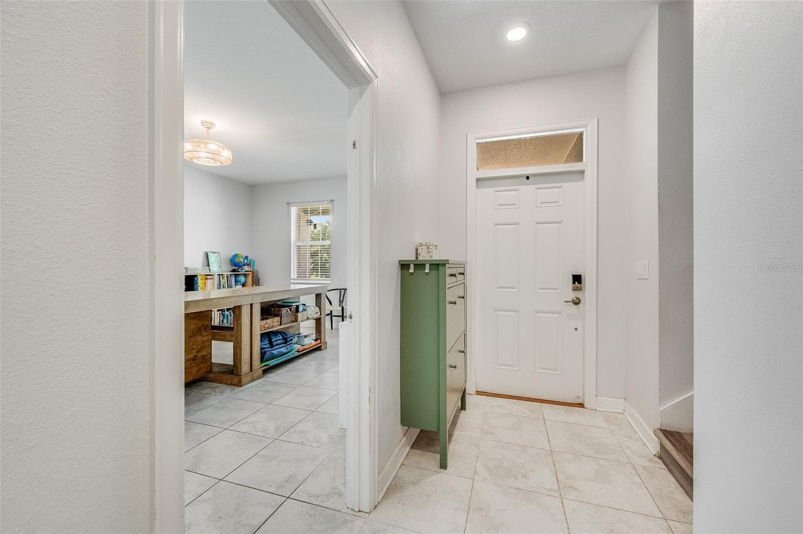 Back downstairs, foyer has access door into multi-gen suite, and there's a separate exterior entrance to the multi-gen suite - 2353 CRESCENT MOON ST, KISSIMMEE