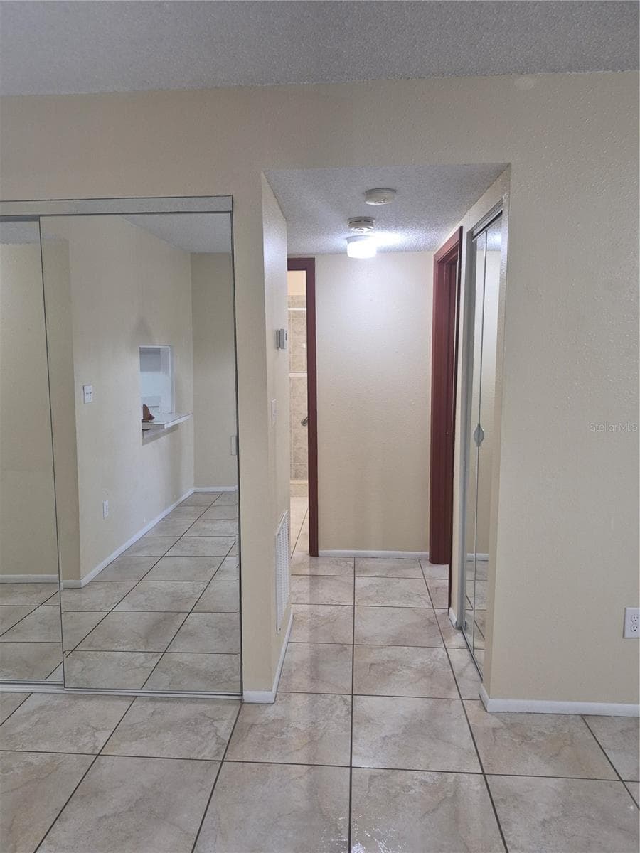 View from dining to bedrooms and bathroom - 2806 N POWERS DR #8, ORLANDO