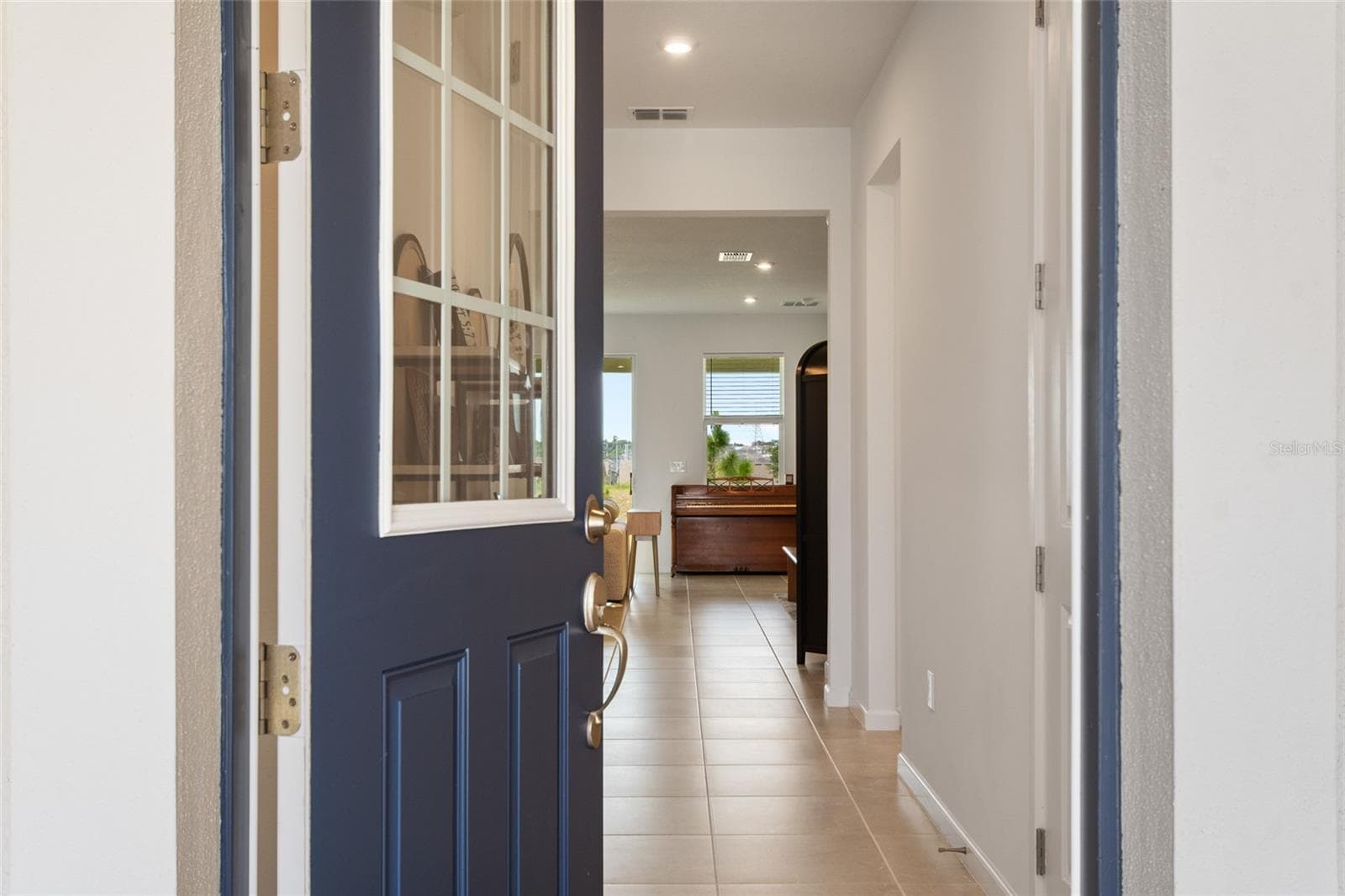 Front door gives way to beautiful natural light and well laid out split plan. - 2685 SWEET ACACIA DR, CLERMONT