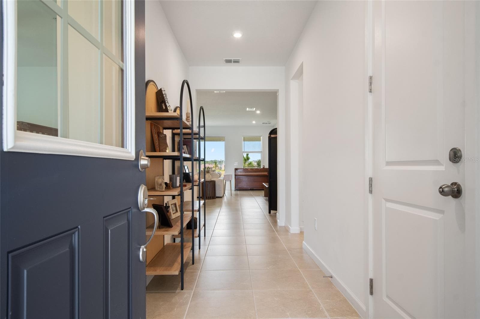 As you enter the garage door is immediately to your right allowing easy access on rainy days for unloading groceries or packages. - 2685 SWEET ACACIA DR, CLERMONT