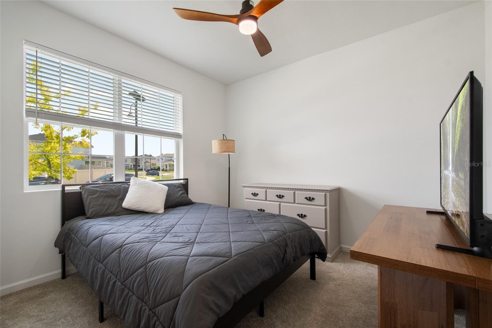 Tucked in its own hallway Bedroom 4 has Bathroom 3 and the laundry room within easy close by access. - 2685 SWEET ACACIA DR, CLERMONT
