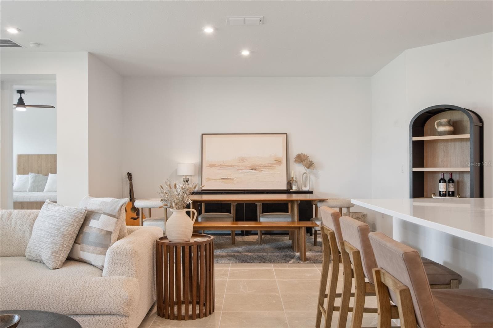 The dedicated dining area is cozy with the left wall defining it as "dining" area but still it is integrated into the great room and allows for friends to chat from dining table directly to all other areas in great room. - 2685 SWEET ACACIA DR, CLERMONT