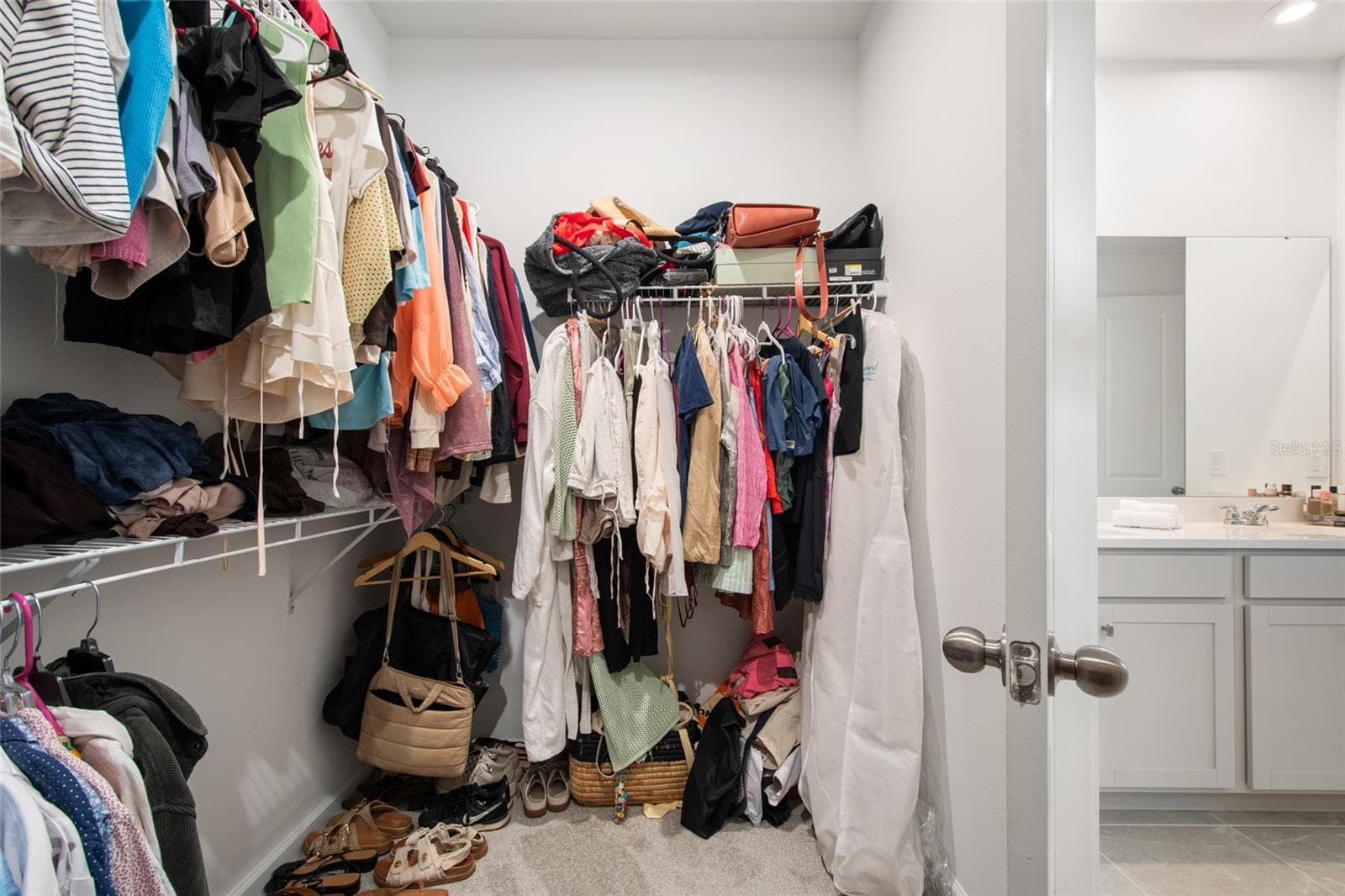 At the end of the primary bath is the oversized walk in closet. - 2685 SWEET ACACIA DR, CLERMONT